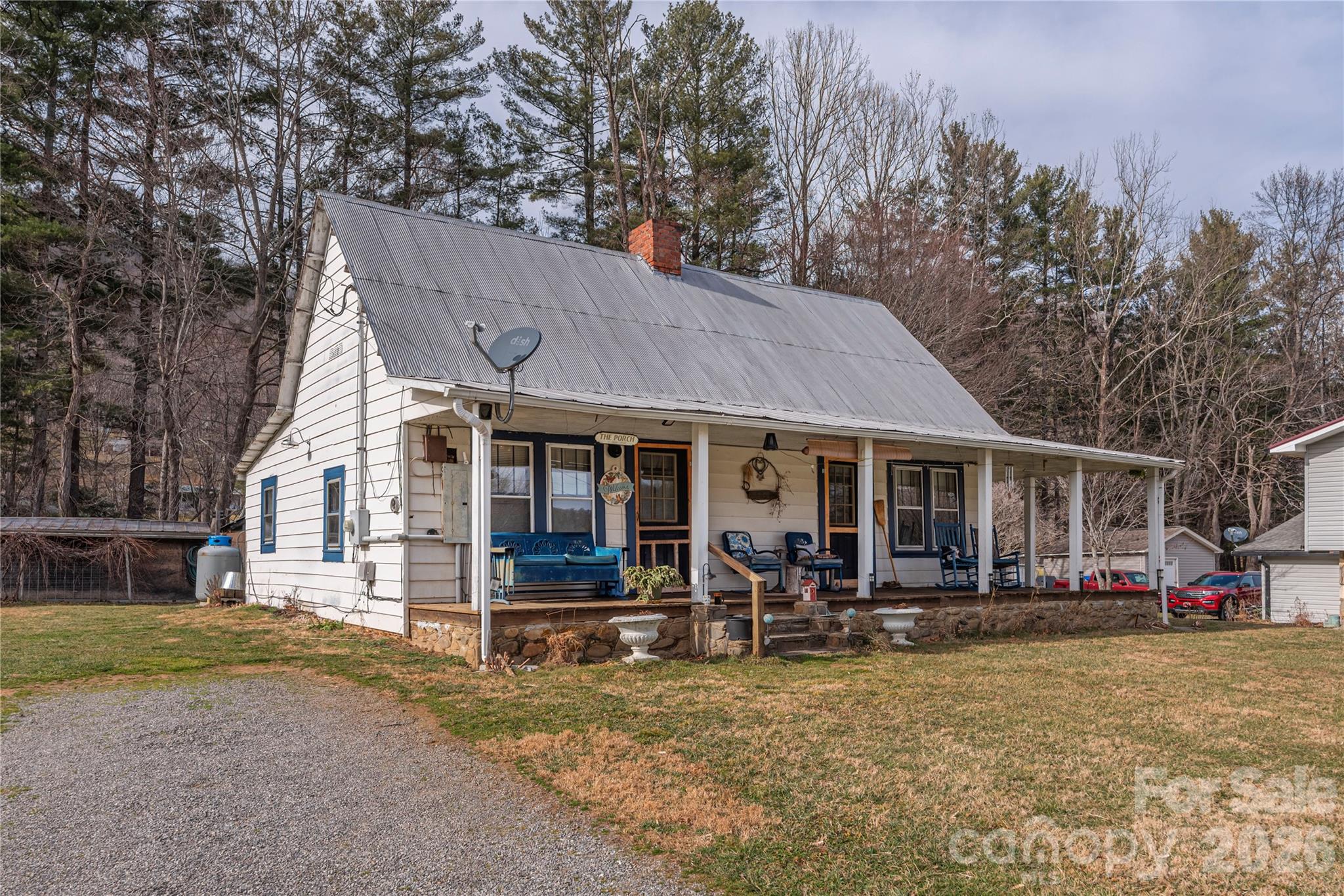 1496 Allens Creek Road Waynesville, NC 28786 - Photo 2 of 25 a view of a house with a backyard and sitting area