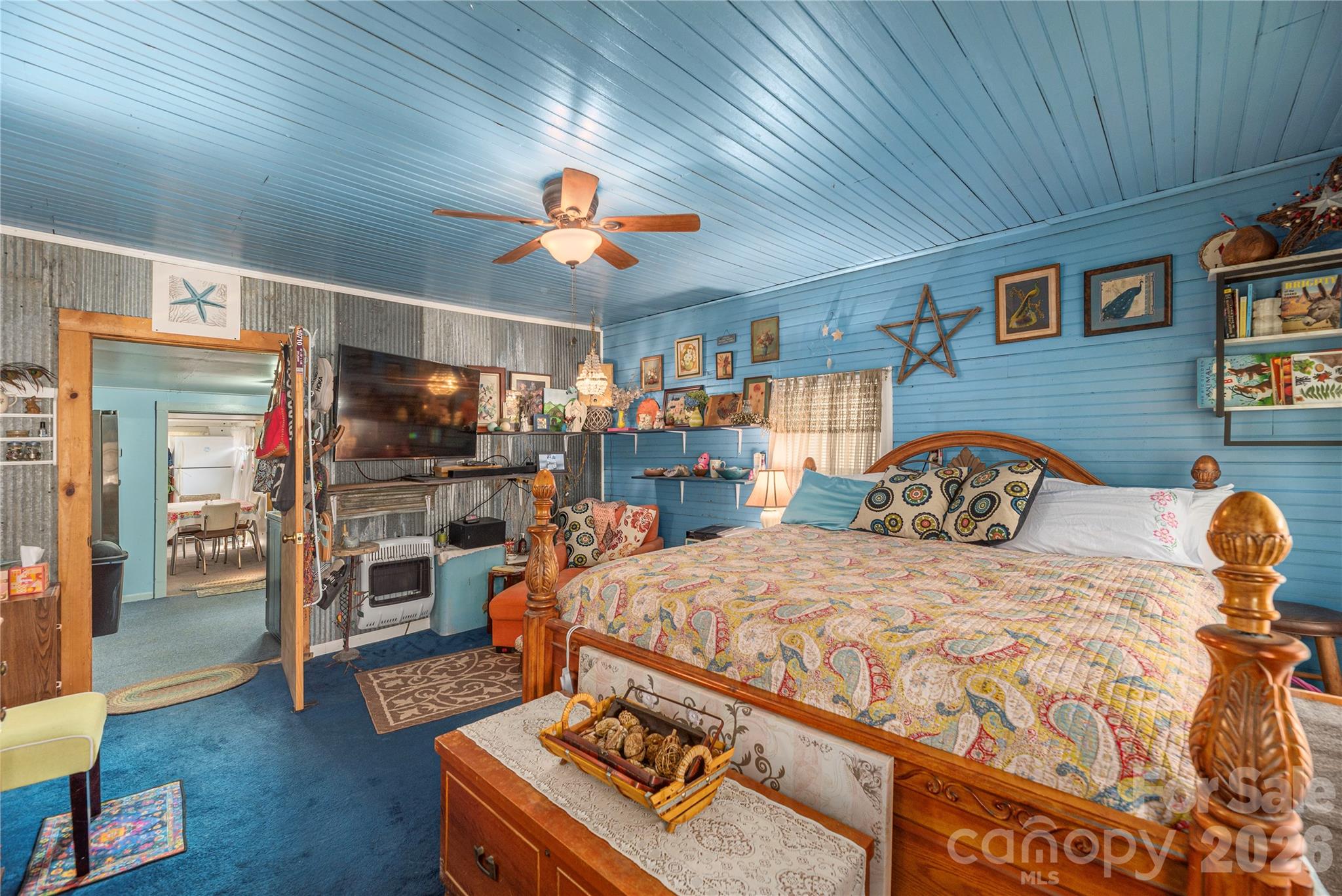 1496 Allens Creek Road Waynesville, NC 28786 - Photo 10 of 25 a bedroom with a bed and a table