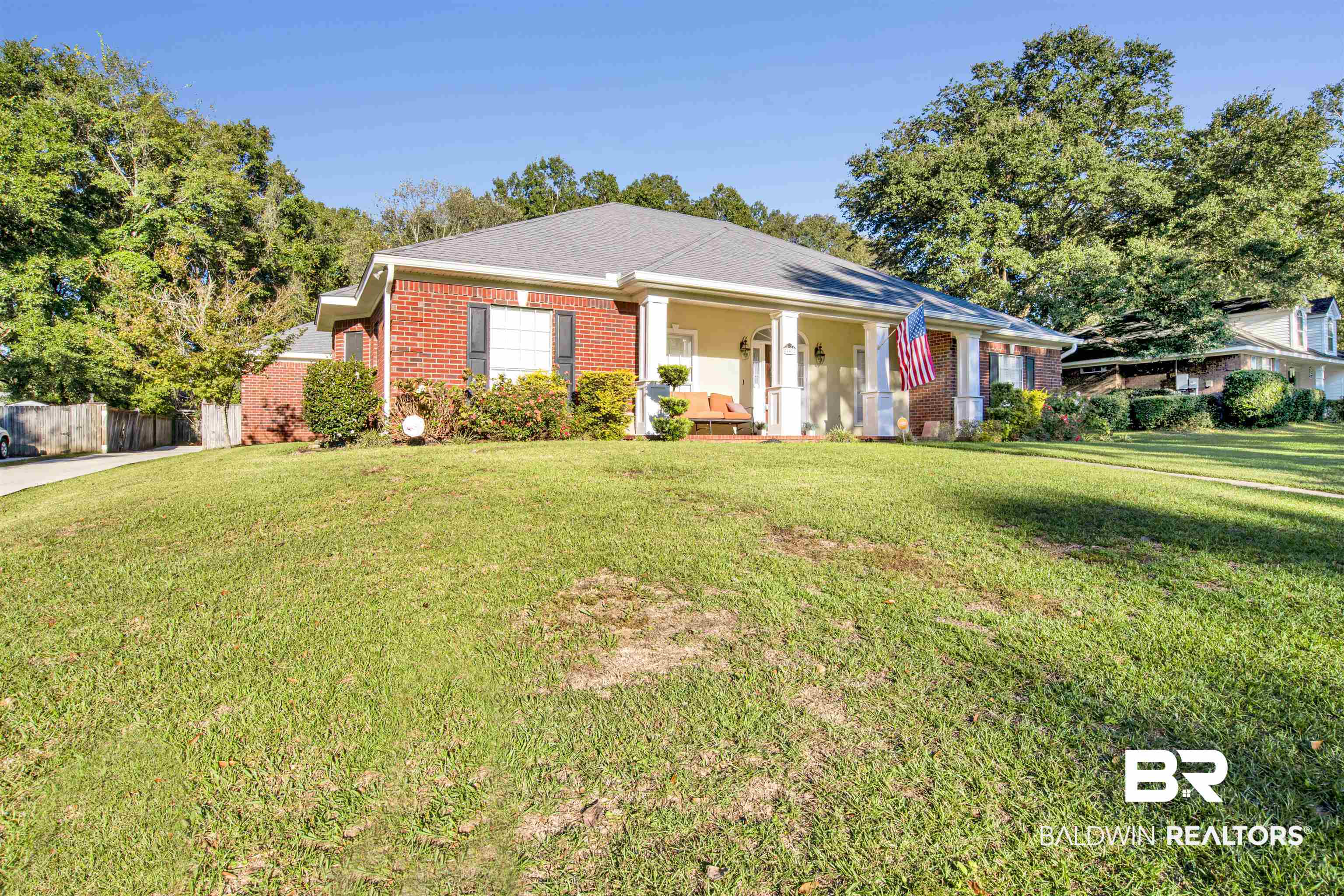 445 Wedgefield Drive South Mobile, AL 36608 - Photo 33 of 36 Ranch-style home featuring covered porch and a front yard