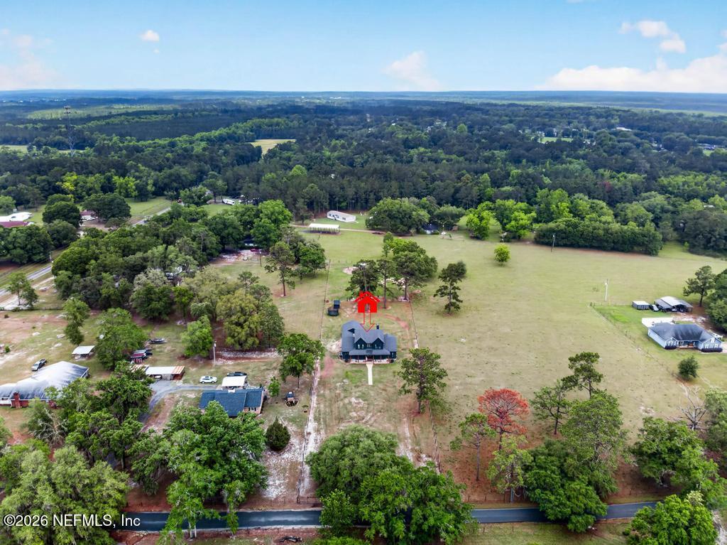 2955 Carroll Corner Road Hilliard, FL 32046 - Photo 95 of 106 an aerial view of a houses with a lake view