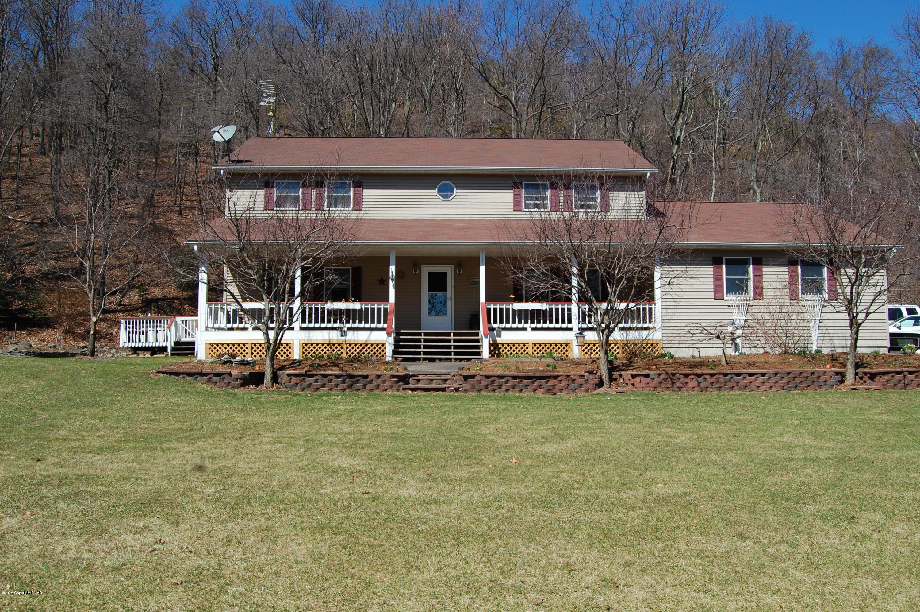201 Grange Road Mount Pocono, PA 18344 - Photo 1 of 27 a view of a house with a garden and sitting area