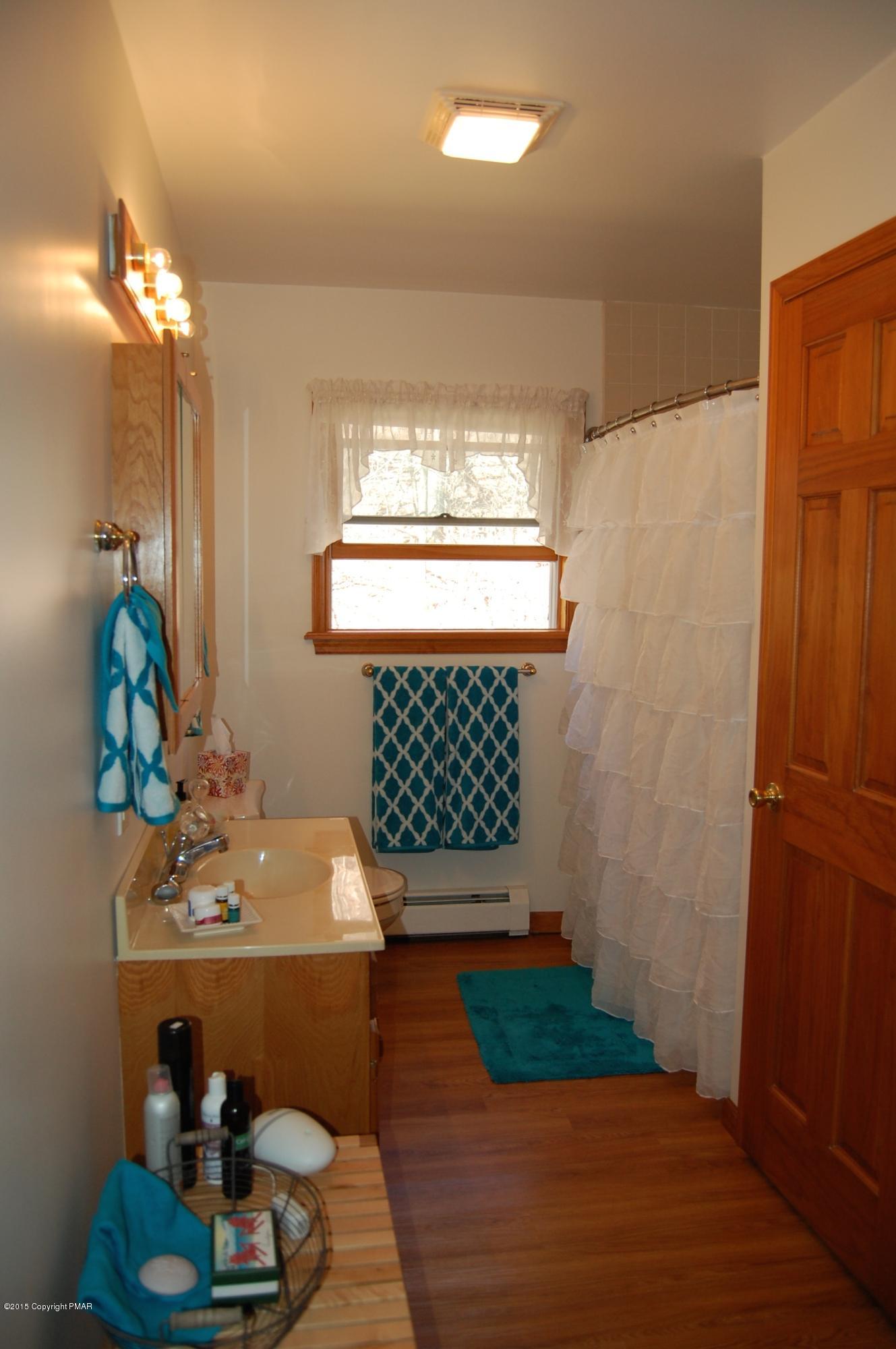 201 Grange Road Mount Pocono, PA 18344 - Photo 13 of 27 a bathroom with a sink mirror and vanity