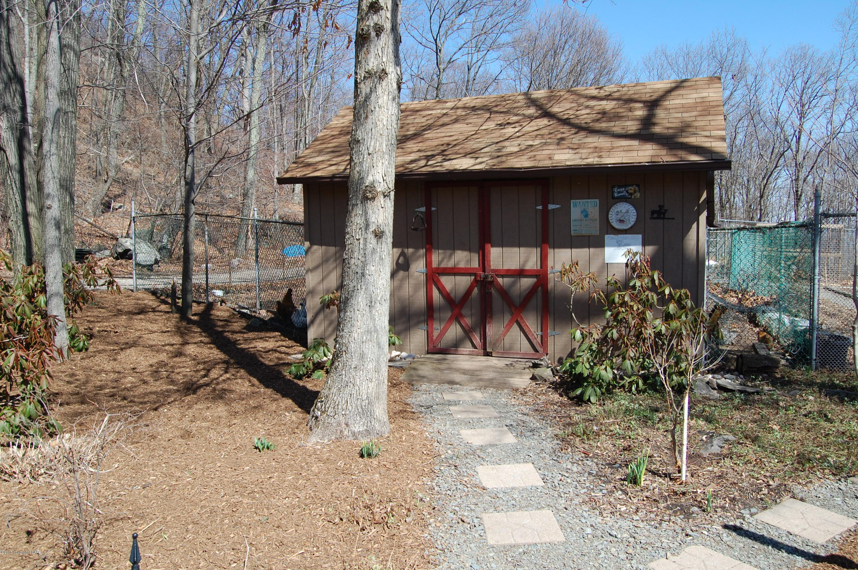 201 Grange Road Mount Pocono, PA 18344 - Photo 25 of 27 a view of a house with a small yard and sitting area