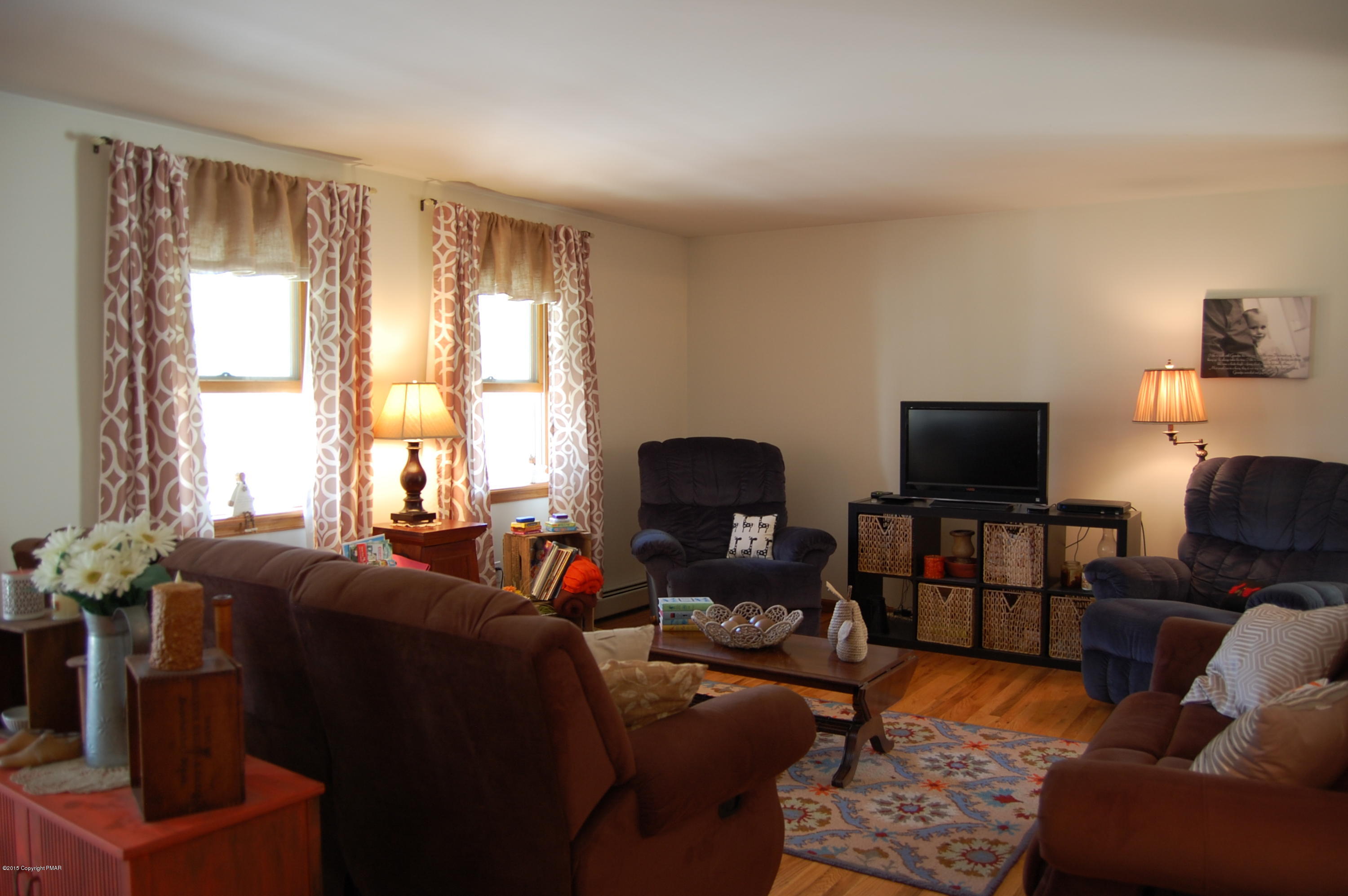 201 Grange Road Mount Pocono, PA 18344 - Photo 4 of 27 a living room with furniture or couch and a flat screen tv