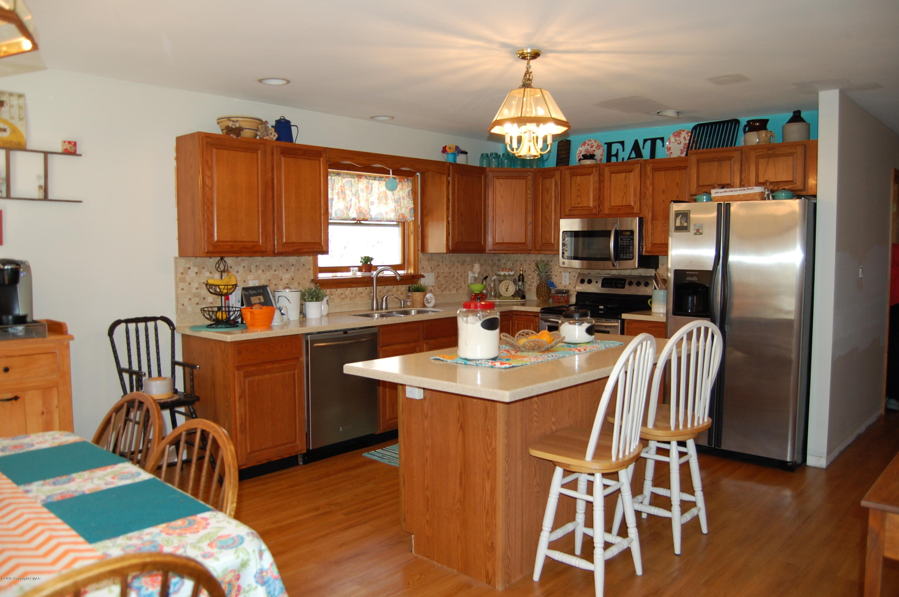 201 Grange Road Mount Pocono, PA 18344 - Photo 6 of 27 a kitchen with stainless steel appliances a sink a table and chairs