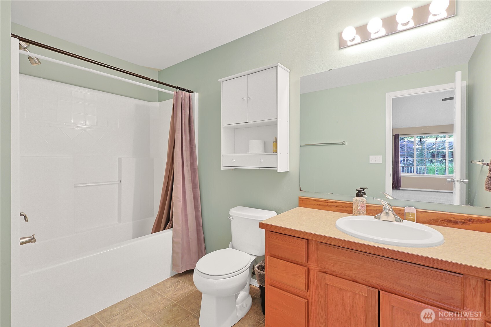 17538 Loop Lane Southeast Yelm, WA 98597 - Photo 11 of 20 a bathroom with a sink toilet and shower