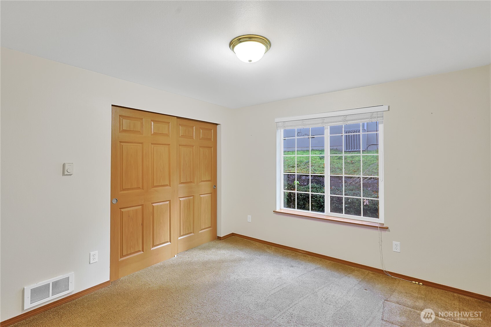 17538 Loop Lane Southeast Yelm, WA 98597 - Photo 13 of 20 a view of a room with gym equipment and windows