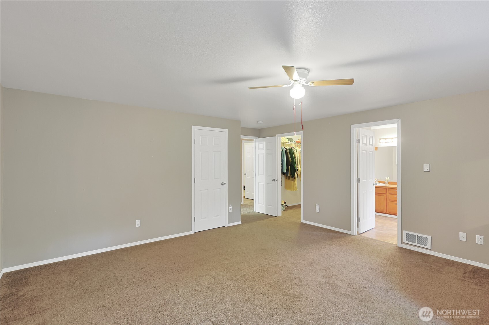 17538 Loop Lane Southeast Yelm, WA 98597 - Photo 15 of 20 an empty room with closet and a ceiling fan