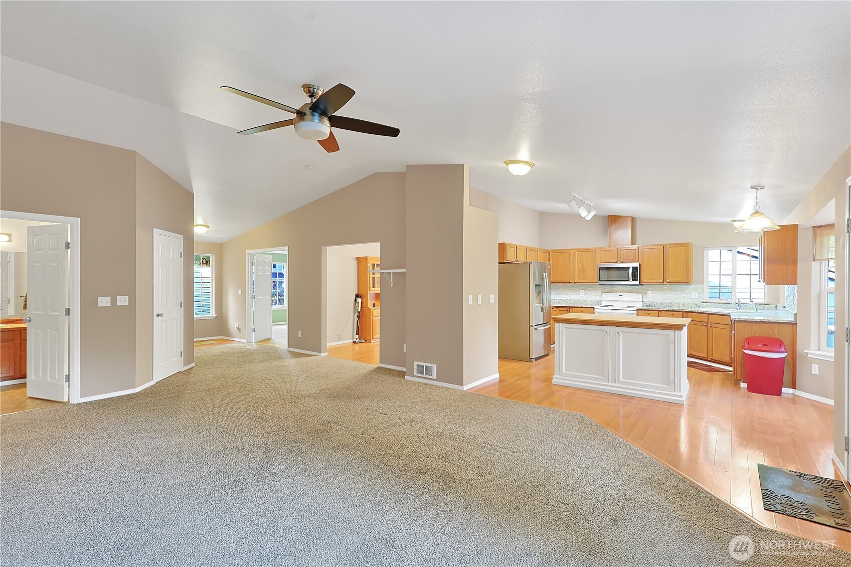 17538 Loop Lane Southeast Yelm, WA 98597 - Photo 3 of 20 a view of a kitchen with a sink and a refrigerator