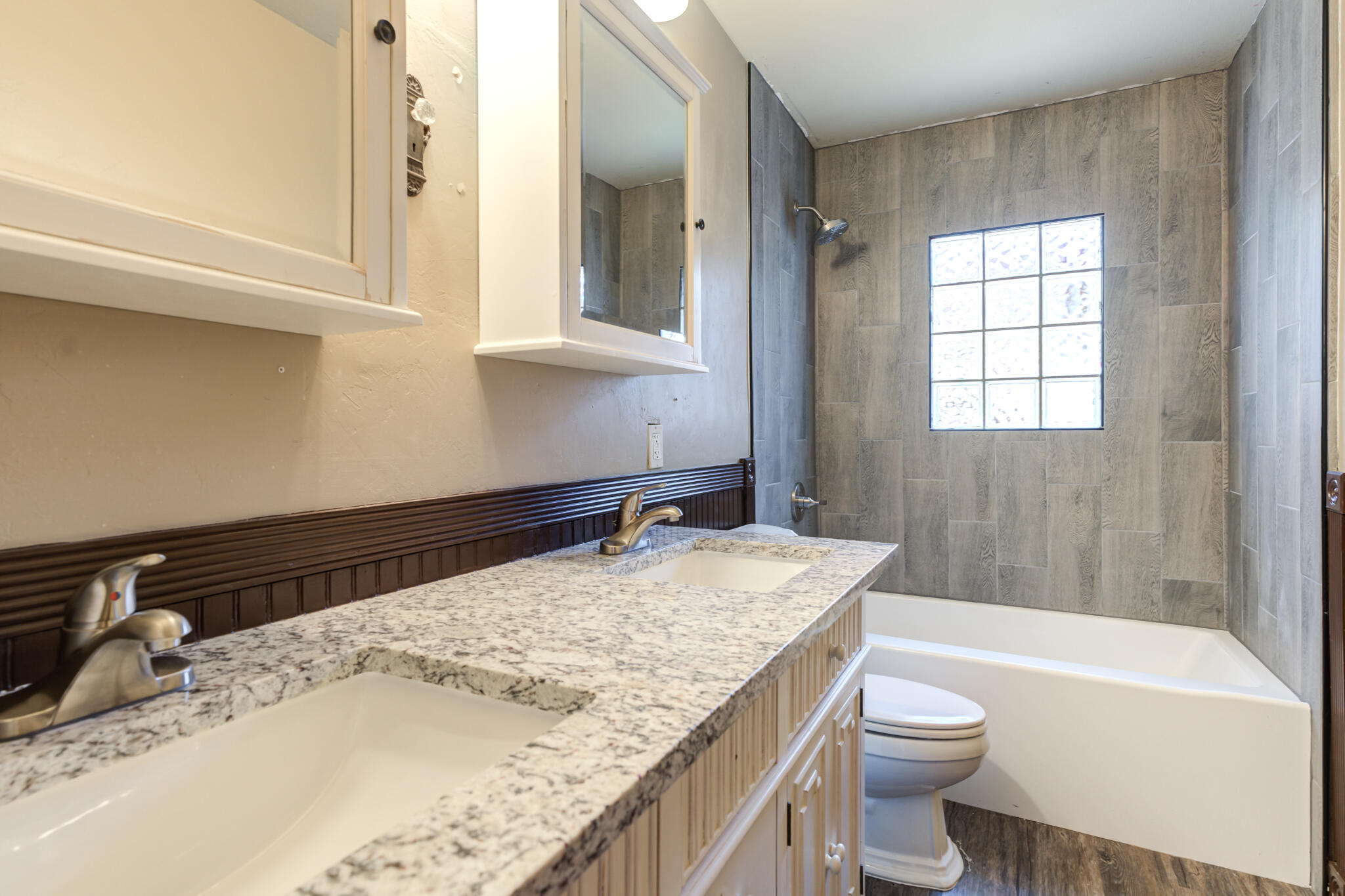 3511 44th Street Lubbock, TX 79413 - Photo 15 of 24 a bathroom with a granite countertop sink toilet and shower