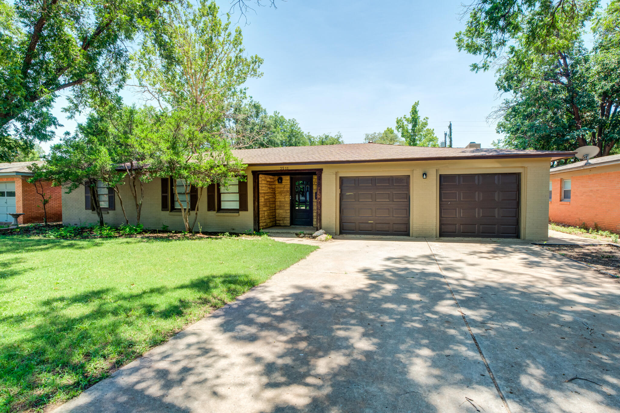 3511 44th Street Lubbock, TX 79413 - Photo 2 of 24 a house with a tree in front of it