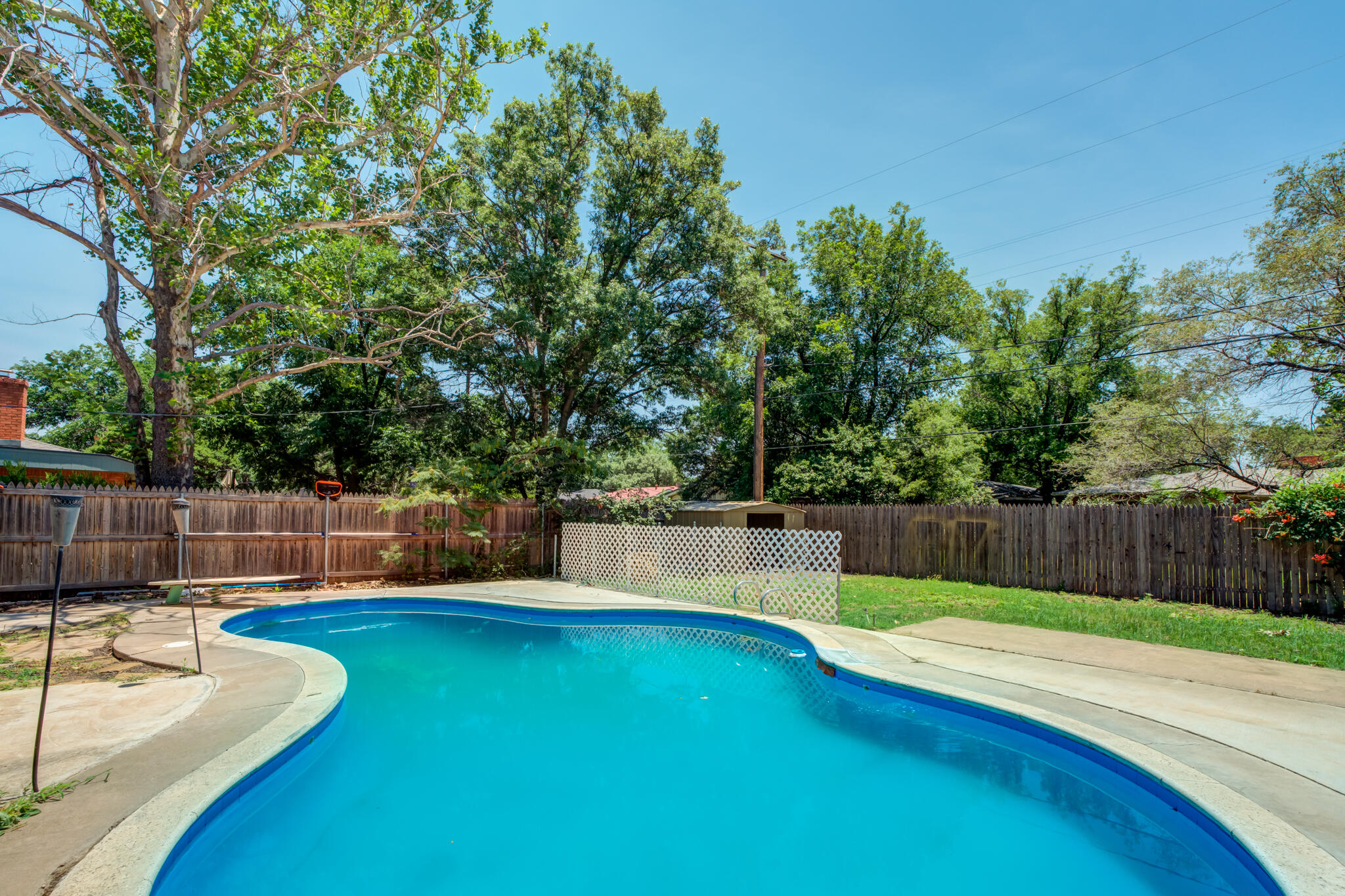 3511 44th Street Lubbock, TX 79413 - Photo 22 of 24 a view of a backyard with swimming pool