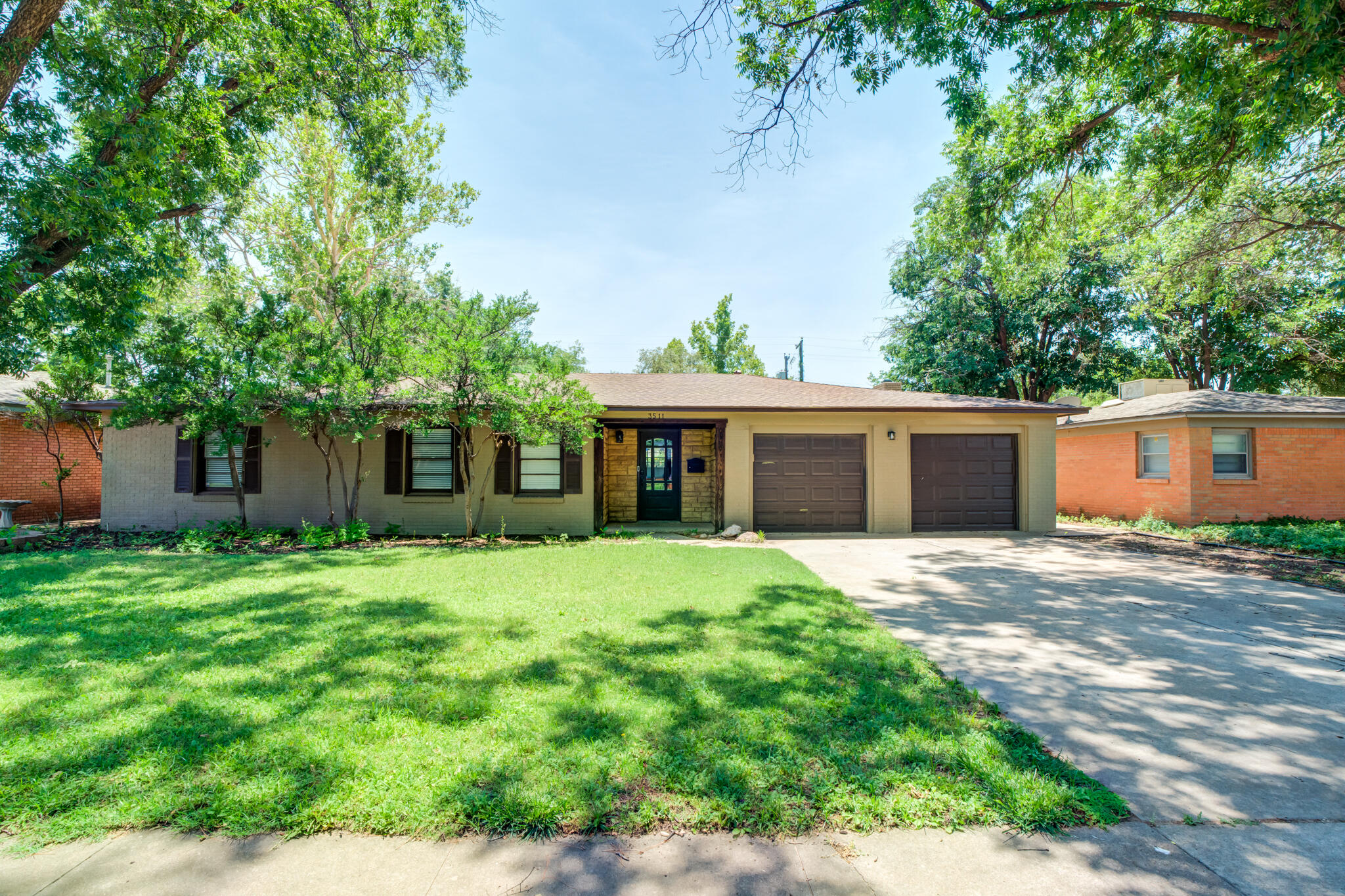 3511 44th Street Lubbock, TX 79413 - Photo 3 of 24 front view of a house with a yard