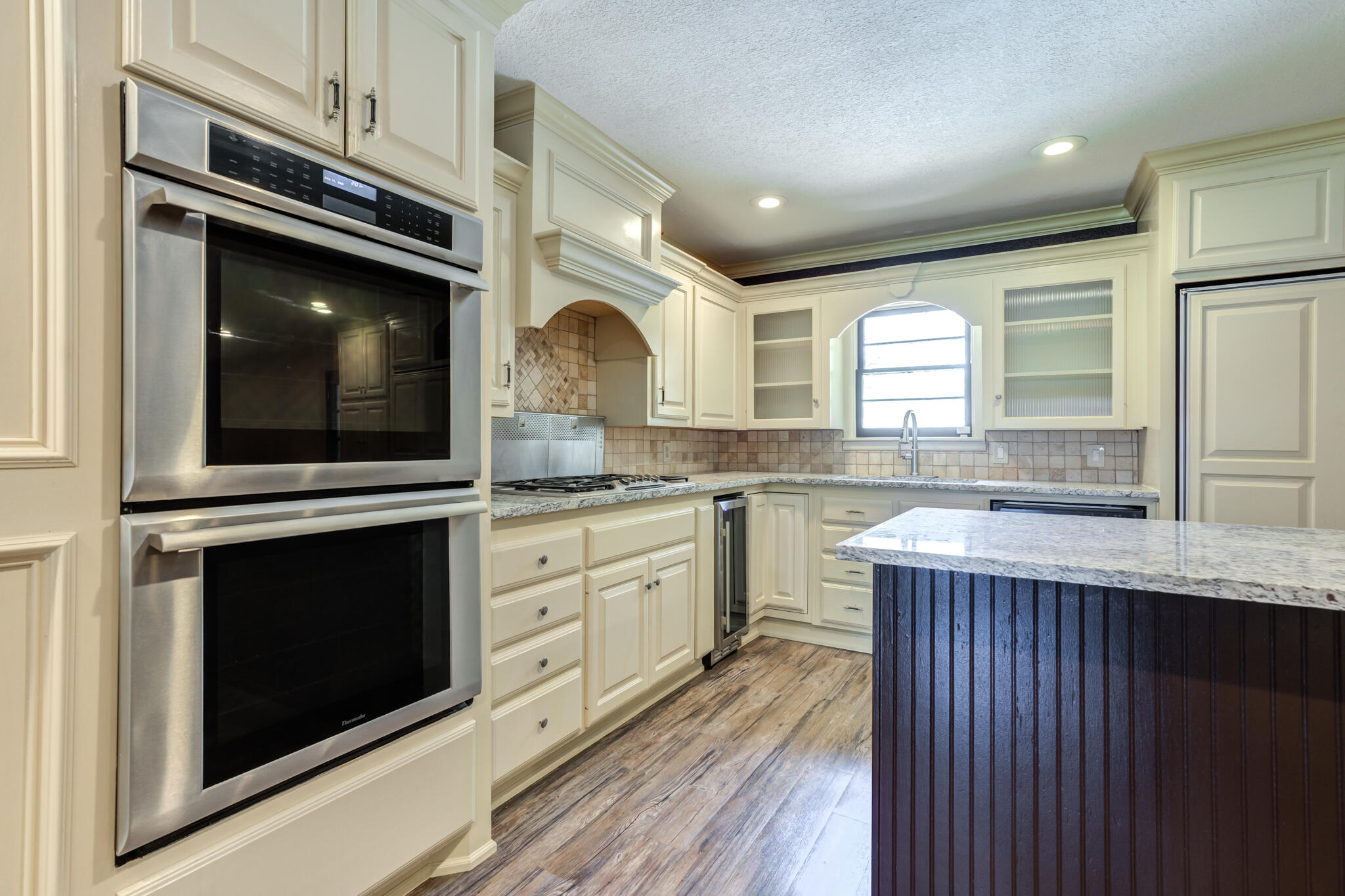 3511 44th Street Lubbock, TX 79413 - Photo 6 of 24 a kitchen with stainless steel appliances granite countertop a stove microwave and sink