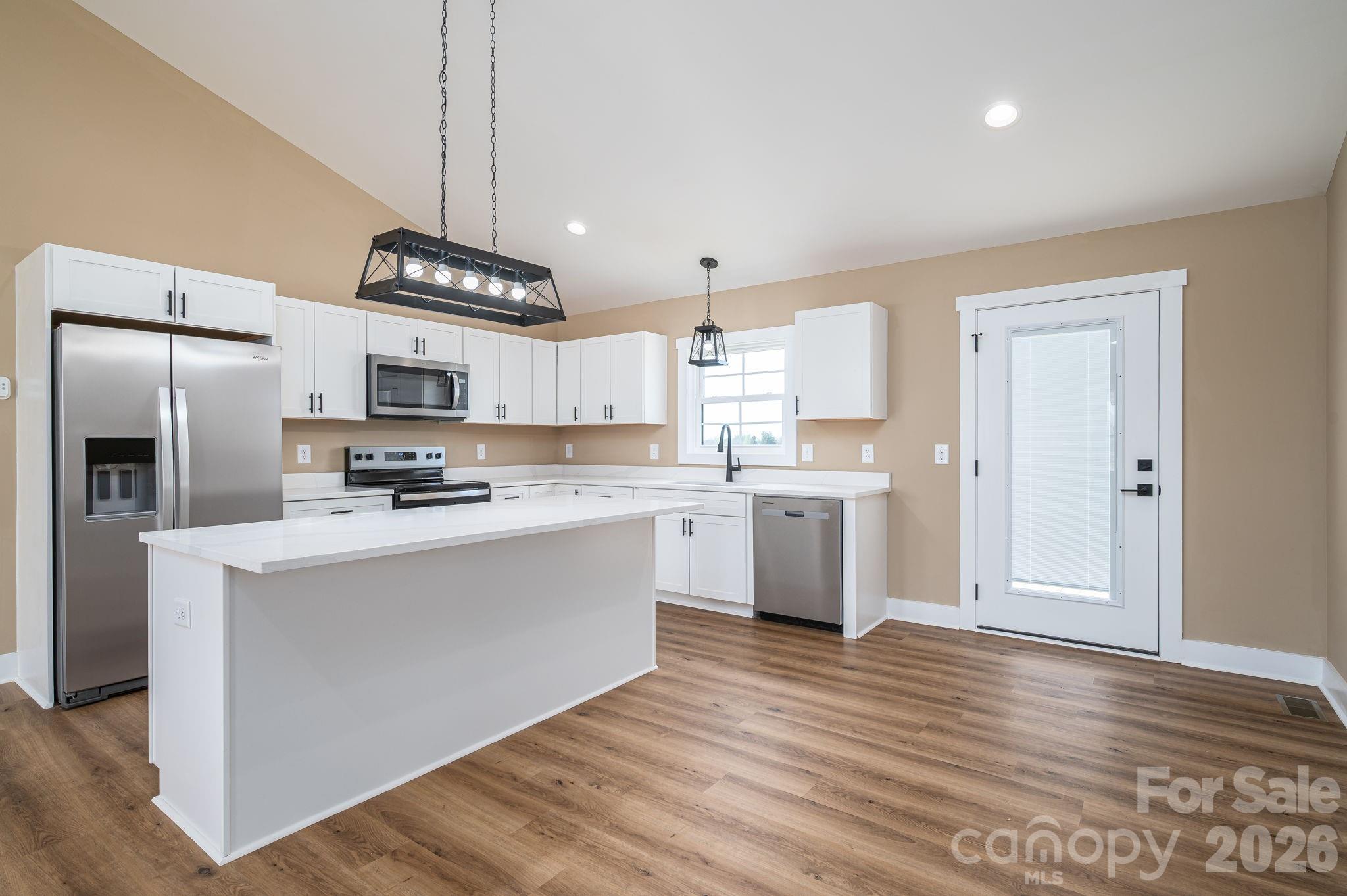 347 Old Belwood Road Lawndale, NC 28090 - Photo 13 of 31 a kitchen with stainless steel appliances a refrigerator sink and microwave