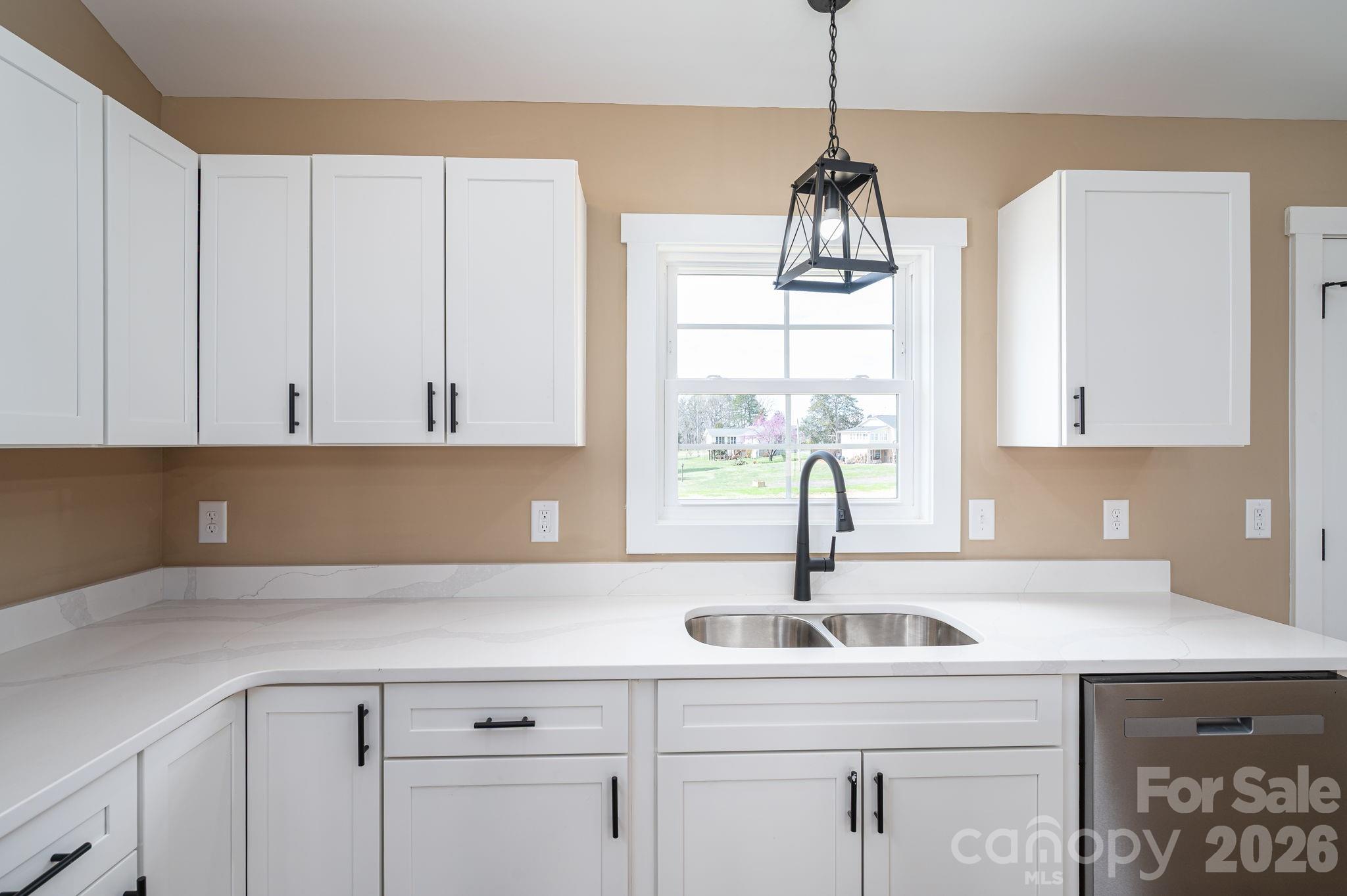 347 Old Belwood Road Lawndale, NC 28090 - Photo 17 of 31 a kitchen with a sink and cabinets