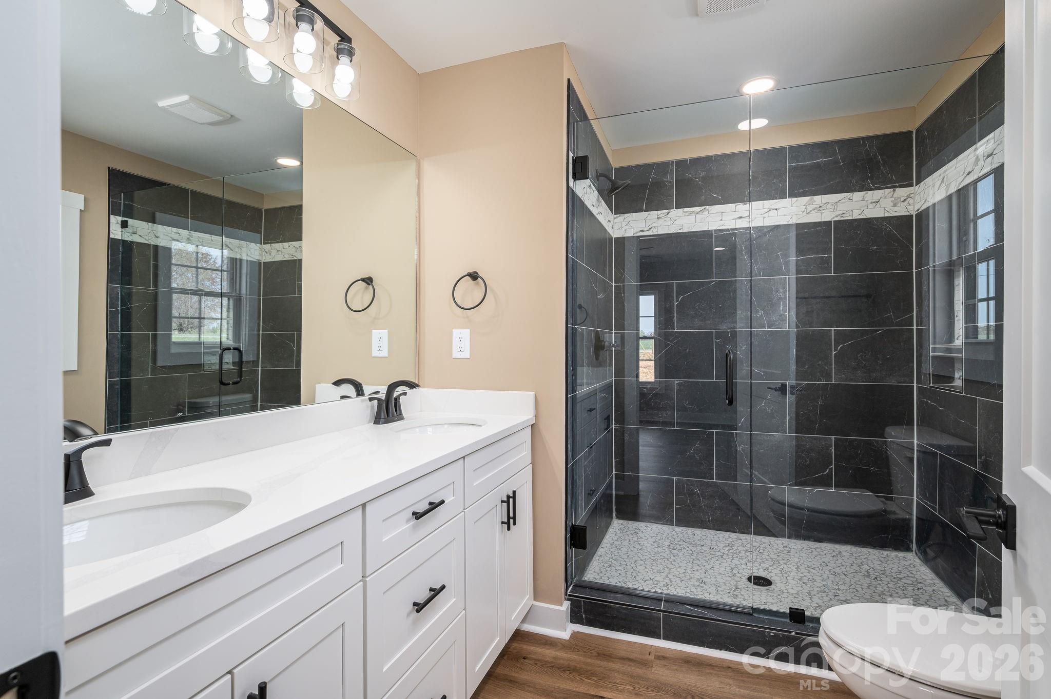 347 Old Belwood Road Lawndale, NC 28090 - Photo 20 of 31 a bathroom with a shower sink and mirror