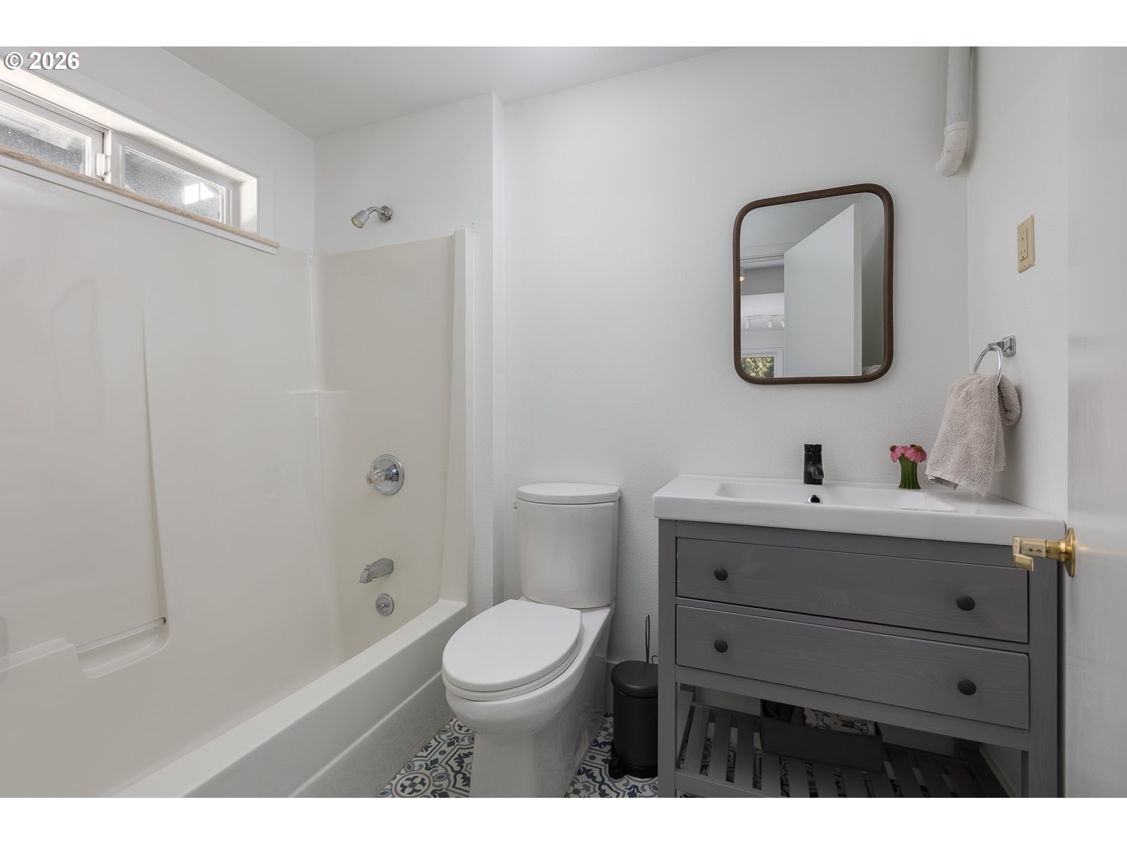 34098 Brooten Road Pacific City, OR 97135 - Photo 27 of 38 a bathroom with a toilet a sink a mirror and vanity