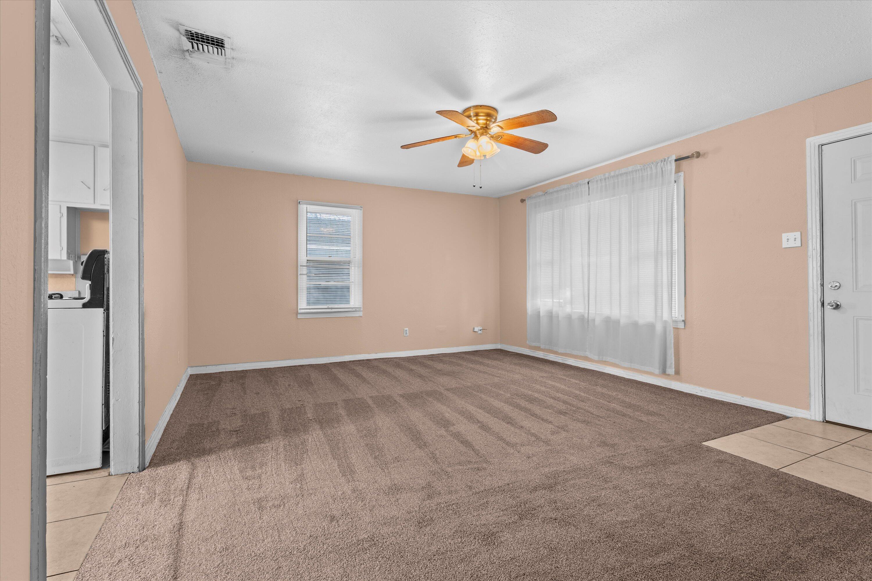 4315 33rd Street Lubbock, TX 79410 - Photo 2 of 16 a view of an empty room with a window