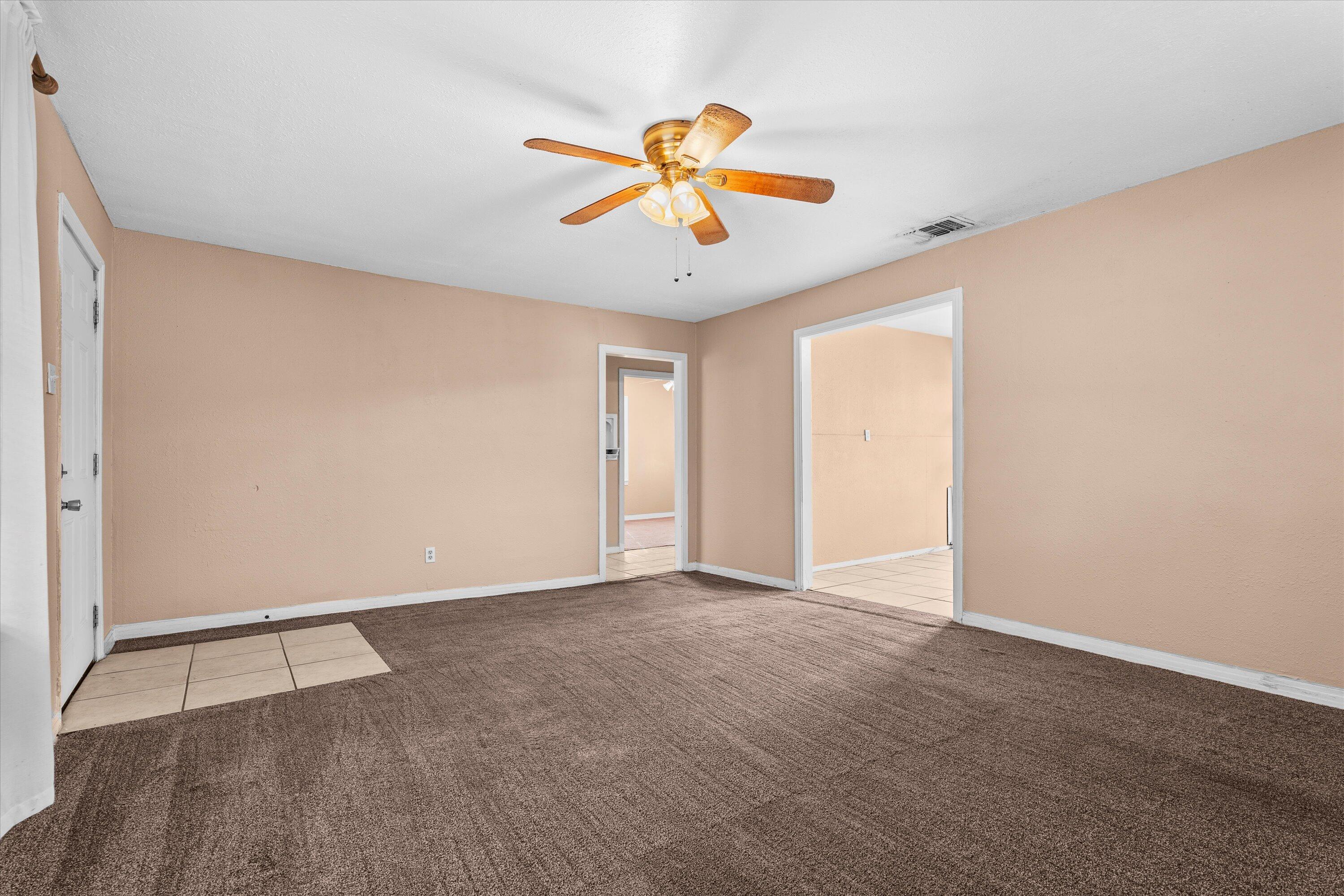 4315 33rd Street Lubbock, TX 79410 - Photo 4 of 16 an empty room with closet and fan