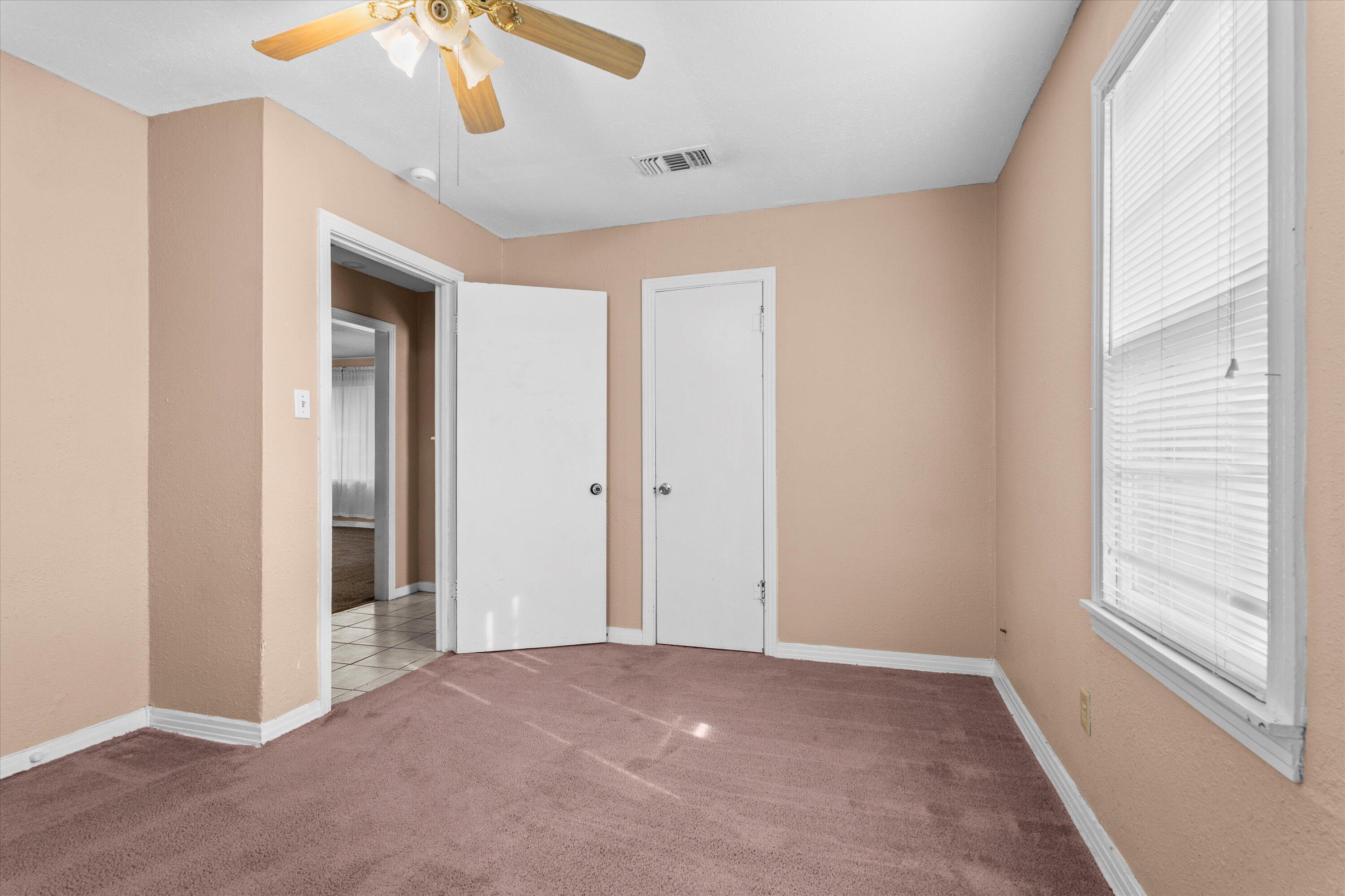 4315 33rd Street Lubbock, TX 79410 - Photo 8 of 16 a view of an empty room with a window