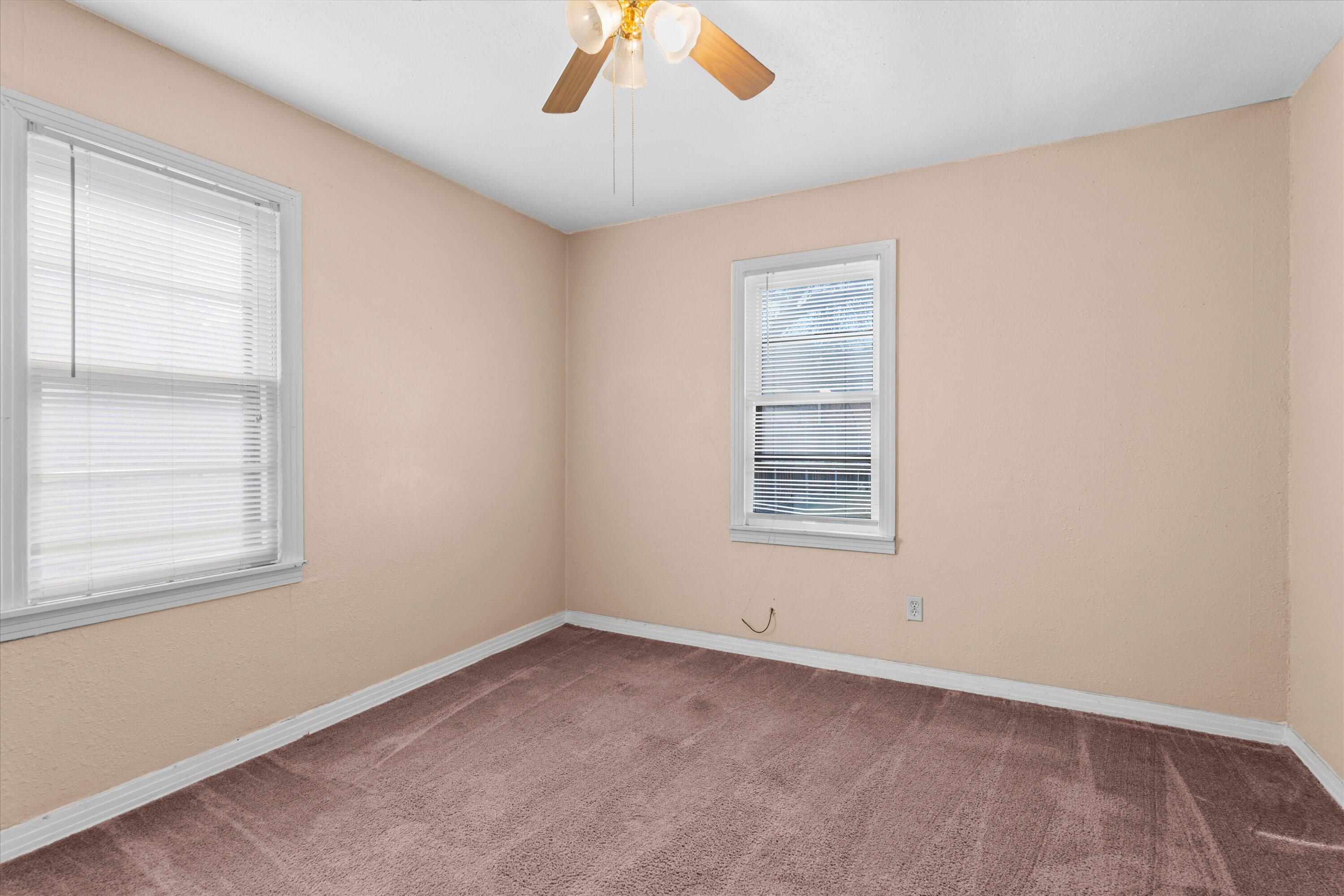 4315 33rd Street Lubbock, TX 79410 - Photo 9 of 16 an empty room with a window