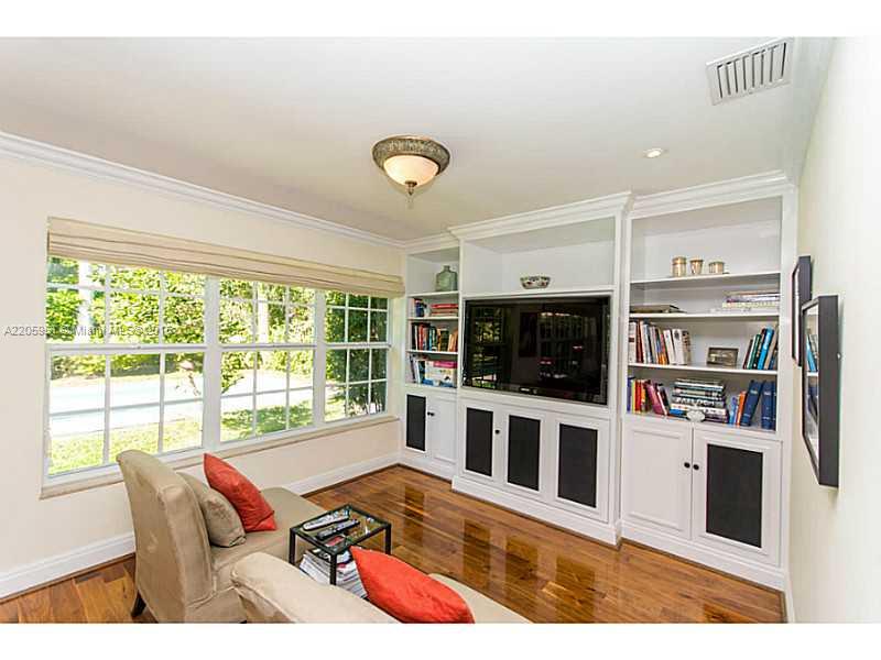 611 Sabal Palm Road Miami, FL 33137 - Photo 17 of 34 a living room with furniture a flat screen tv and a refrigerator