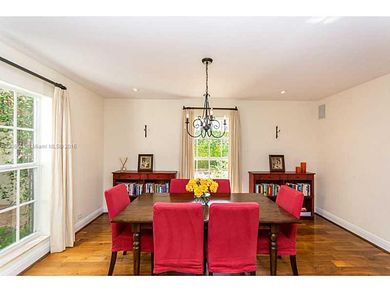 611 Sabal Palm Road Miami, FL 33137 - Photo 3 of 34 a view of a dining room with furniture window and outside view