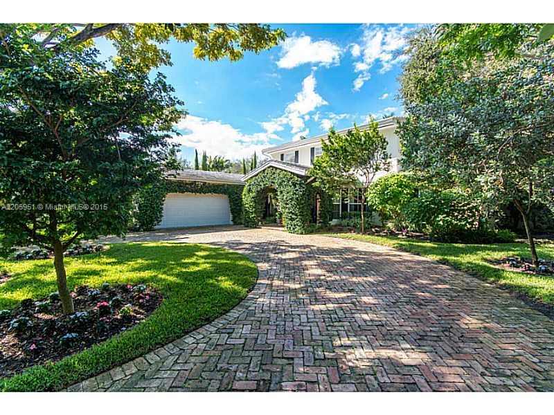 611 Sabal Palm Road Miami, FL 33137 - Photo 7 of 34 a view of a yard with plants and large trees