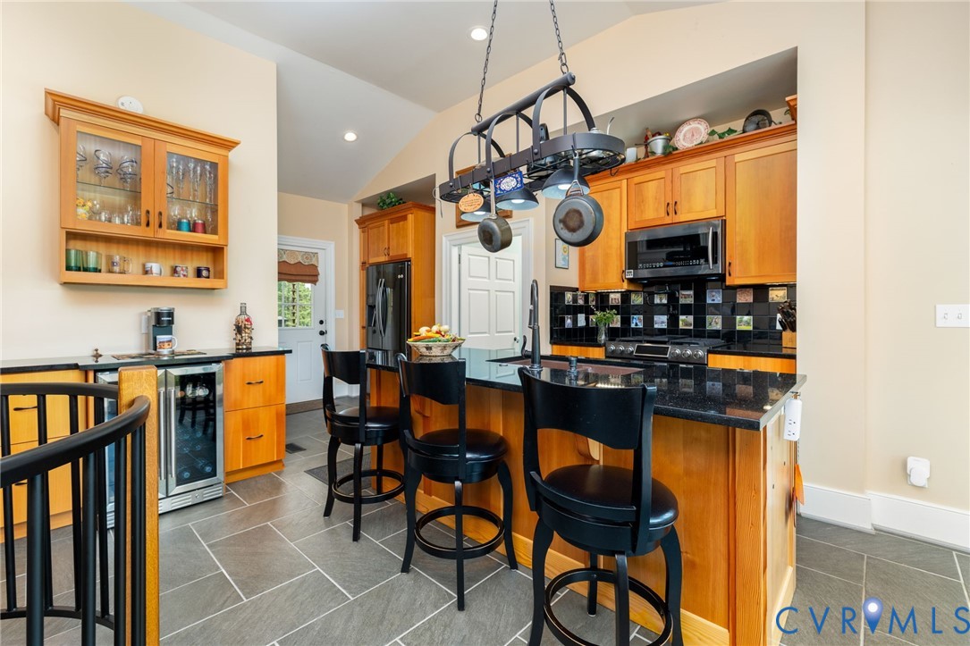 2284 Wallace's Bridge Road Lunenburg, VA 23952 - Photo 9 of 89 Vaulted ceiling kitchen featuring a pot rack, wood