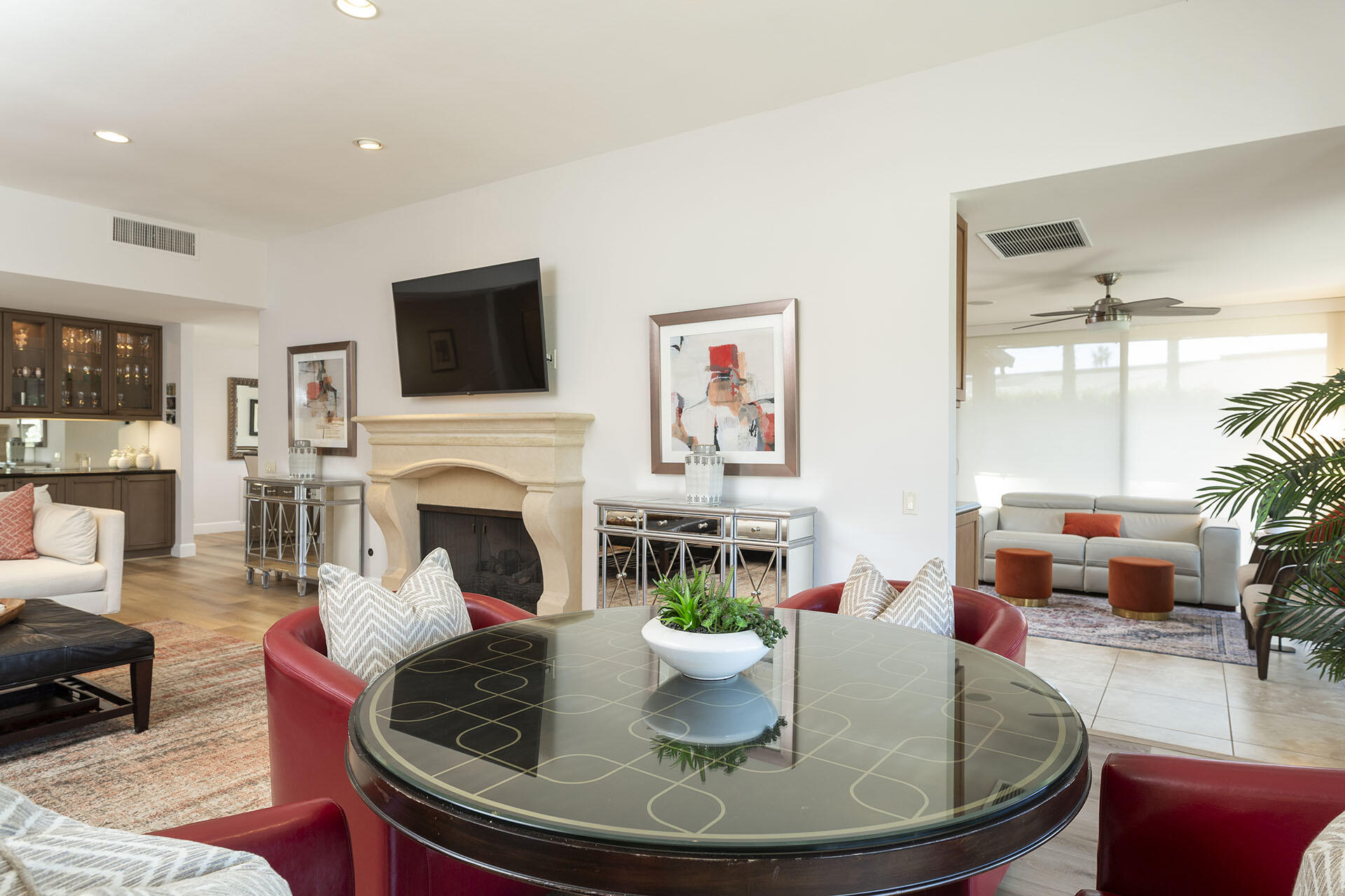32 Colgate Drive Rancho Mirage, CA 92270 - Photo 13 of 51 a dining room with furniture a fireplace and wooden floor
