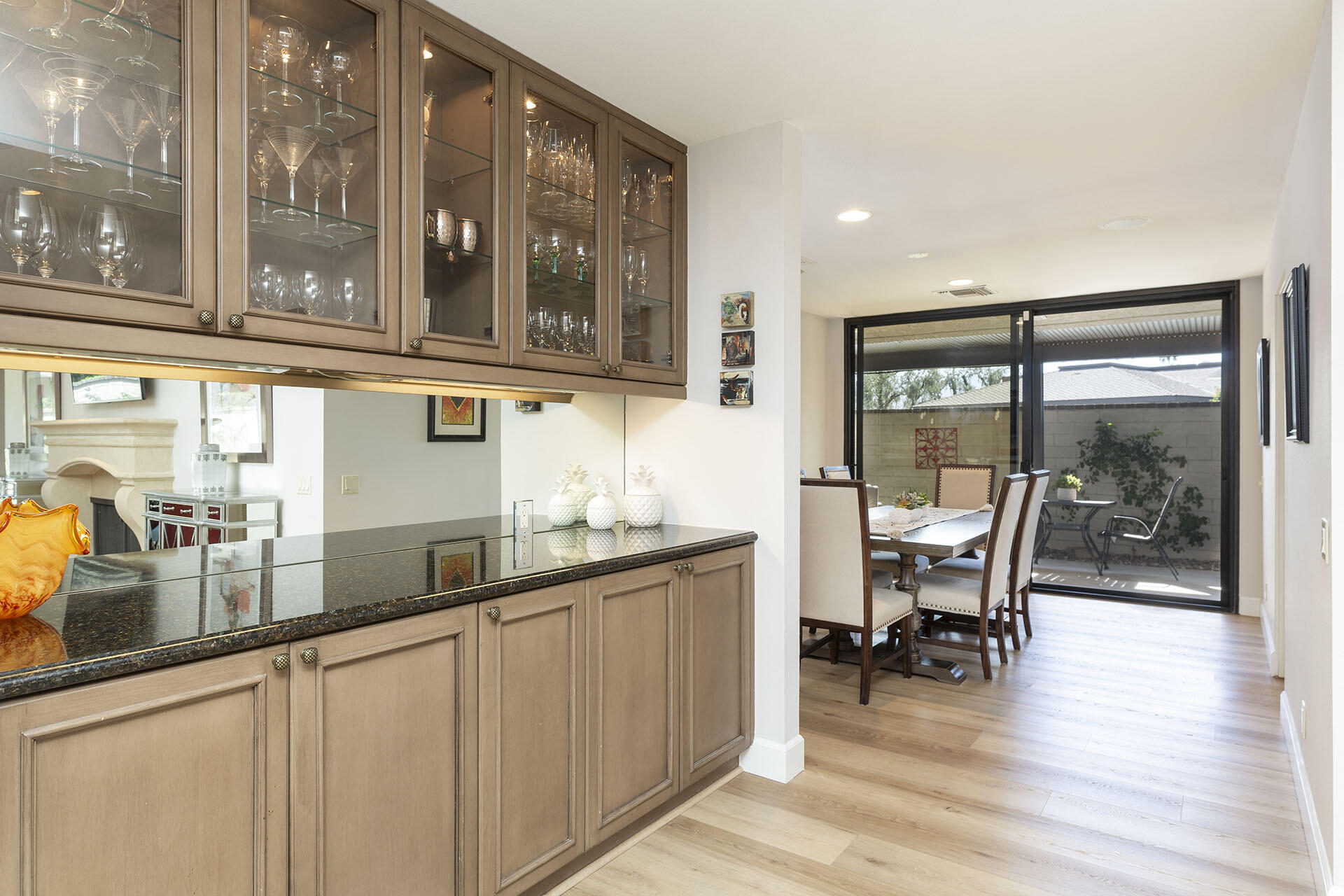 32 Colgate Drive Rancho Mirage, CA 92270 - Photo 16 of 51 a kitchen with stainless steel appliances granite countertop a table and chairs in it