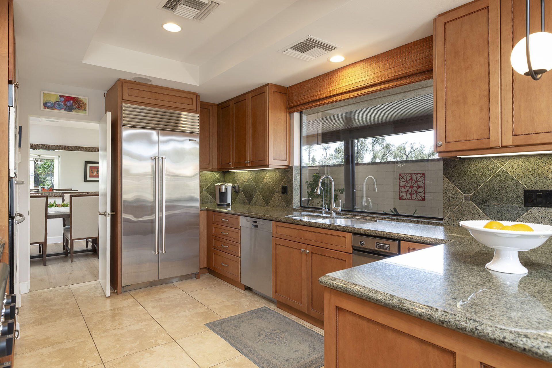 32 Colgate Drive Rancho Mirage, CA 92270 - Photo 17 of 51 a kitchen with stainless steel appliances granite countertop a refrigerator and a sink