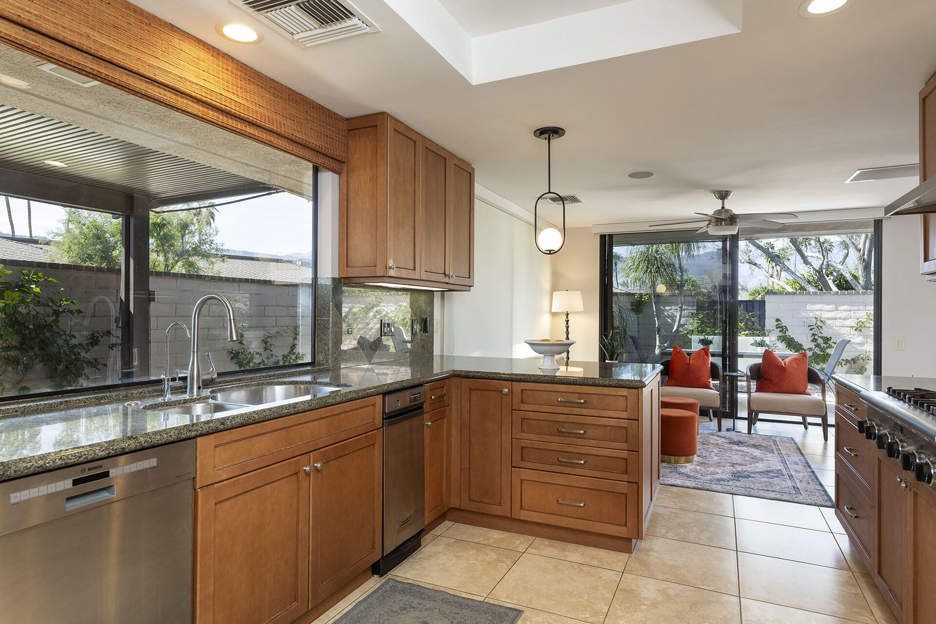 32 Colgate Drive Rancho Mirage, CA 92270 - Photo 18 of 51 a kitchen with a sink and wooden cabinets
