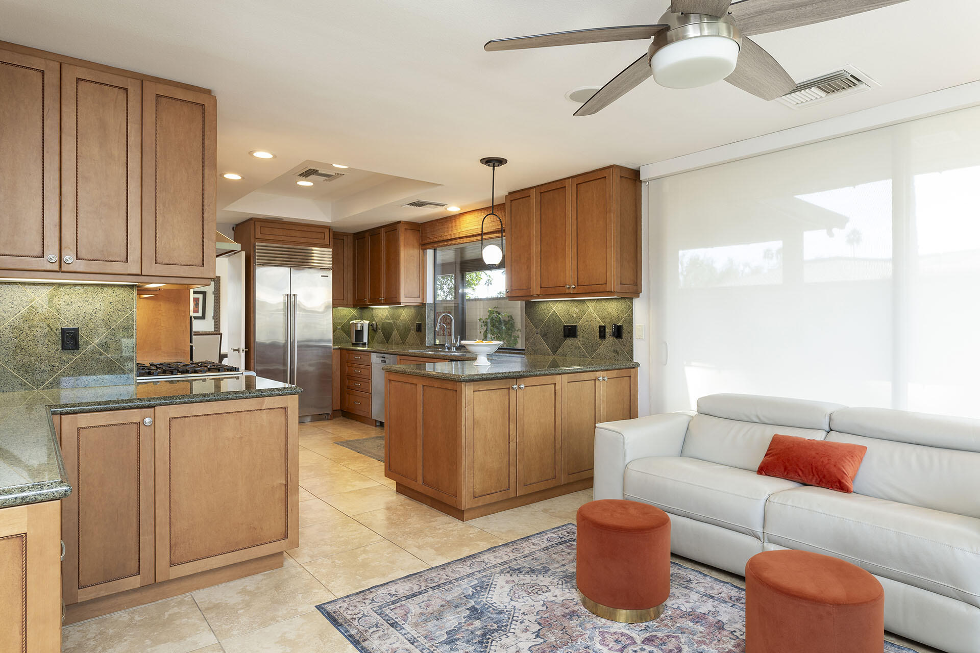32 Colgate Drive Rancho Mirage, CA 92270 - Photo 19 of 51 a living room with stainless steel appliances granite countertop a couch and a view of kitchen