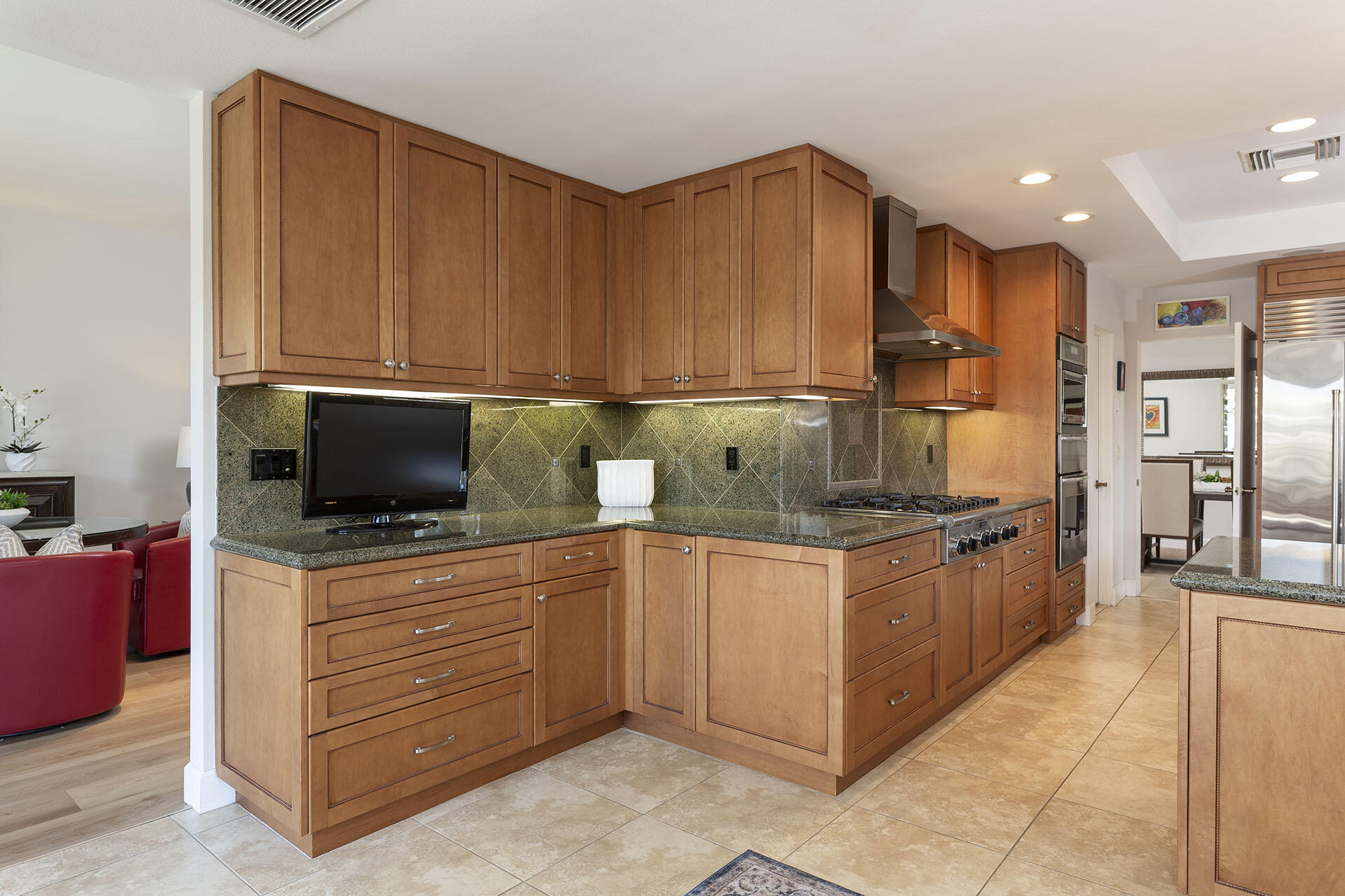 32 Colgate Drive Rancho Mirage, CA 92270 - Photo 20 of 51 a kitchen with stainless steel appliances granite countertop a stove and a refrigerator