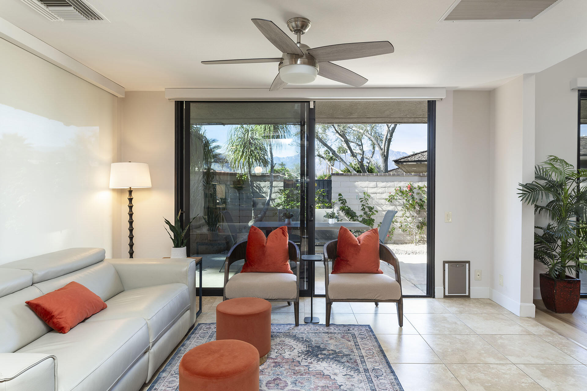 32 Colgate Drive Rancho Mirage, CA 92270 - Photo 21 of 51 a living room with patio furniture and a potted plant