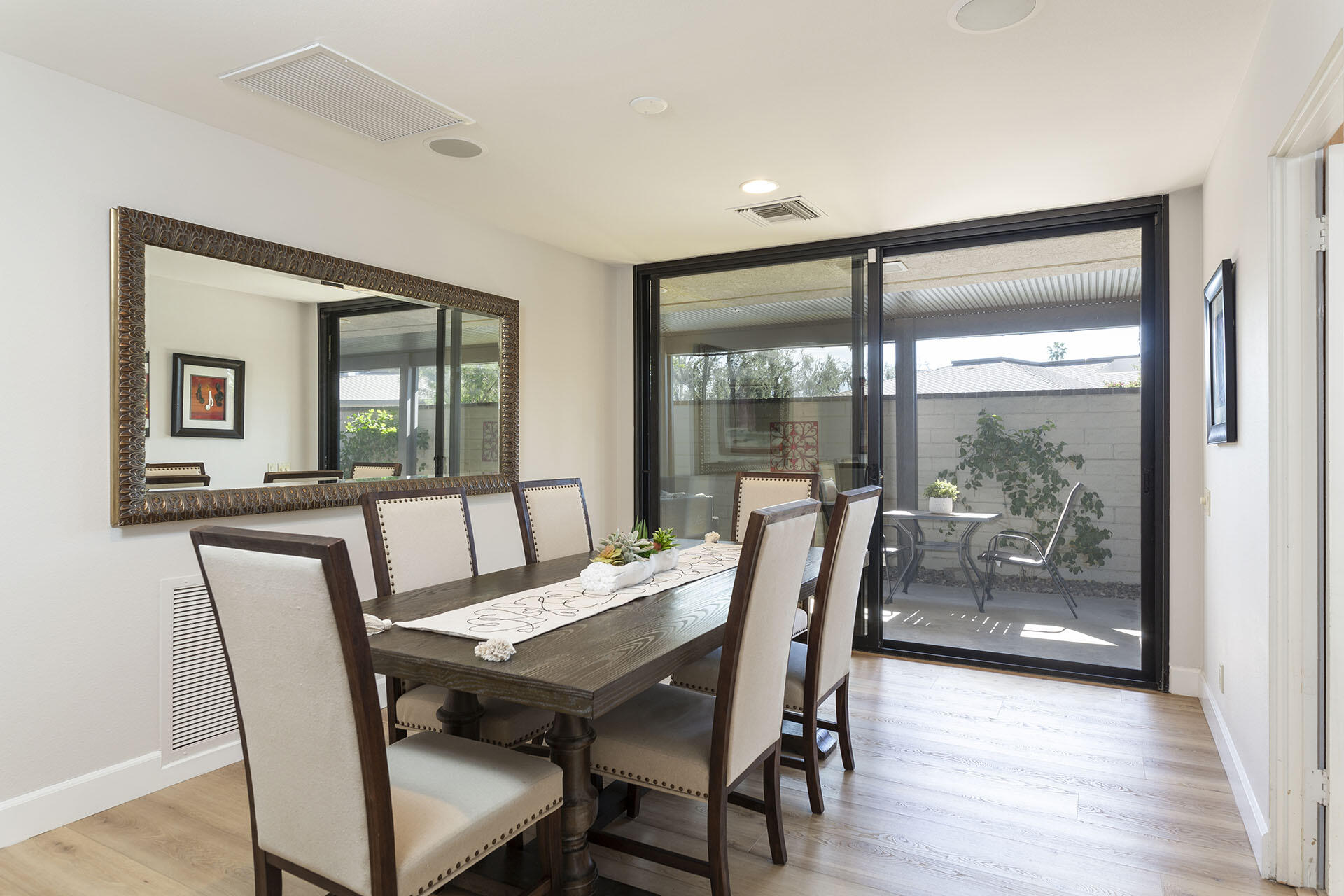 32 Colgate Drive Rancho Mirage, CA 92270 - Photo 22 of 51 a view of a dining room with furniture wooden floor and a potted plant
