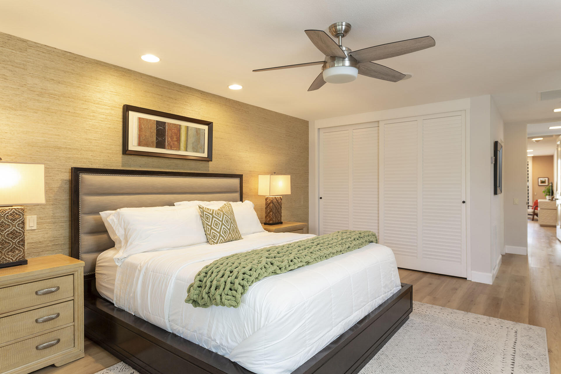 32 Colgate Drive Rancho Mirage, CA 92270 - Photo 27 of 51 a bedroom with a large bed and a ceiling fan