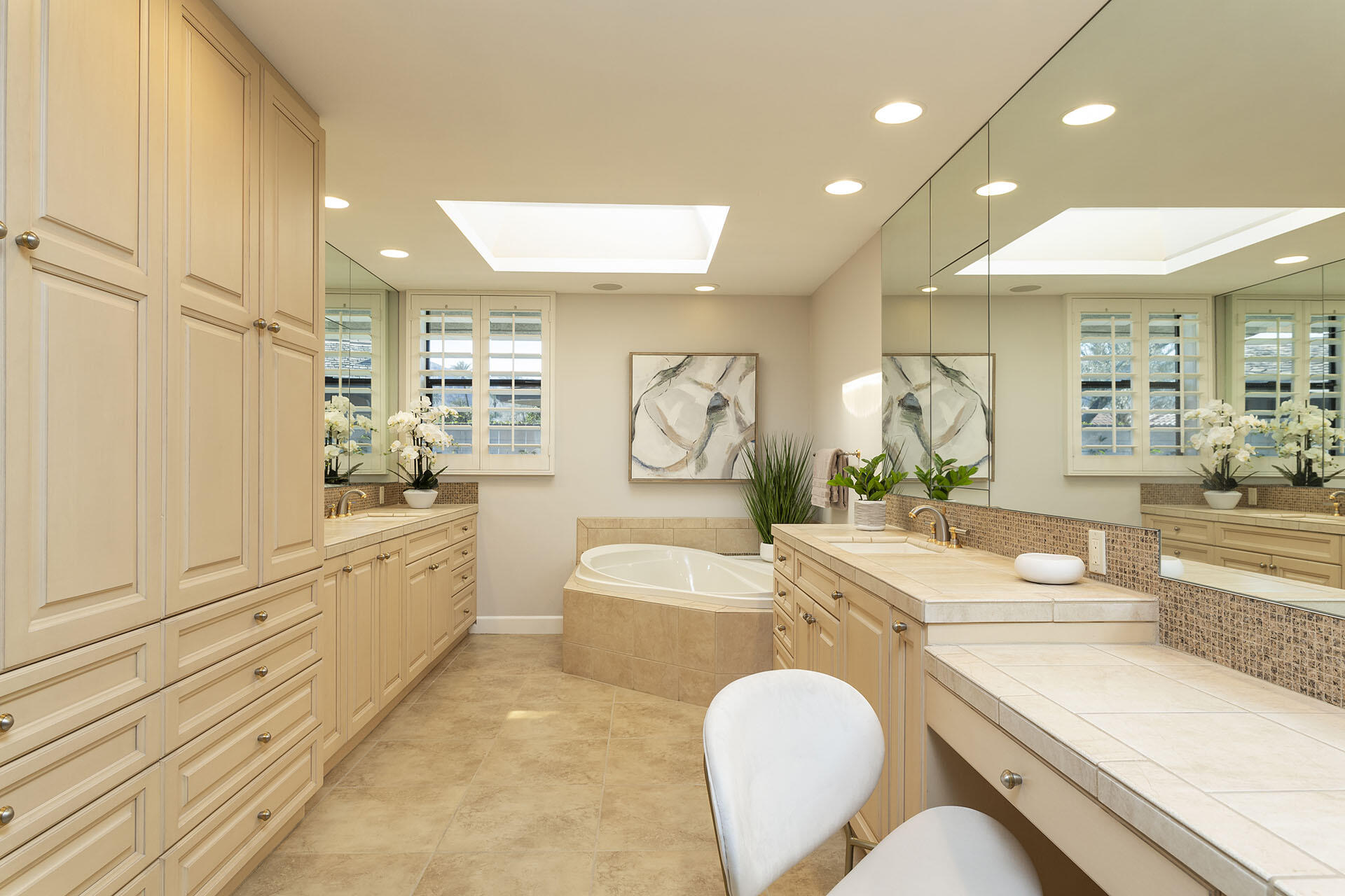 32 Colgate Drive Rancho Mirage, CA 92270 - Photo 28 of 51 a large bathroom with a granite countertop tub double vanity sink and a large mirror