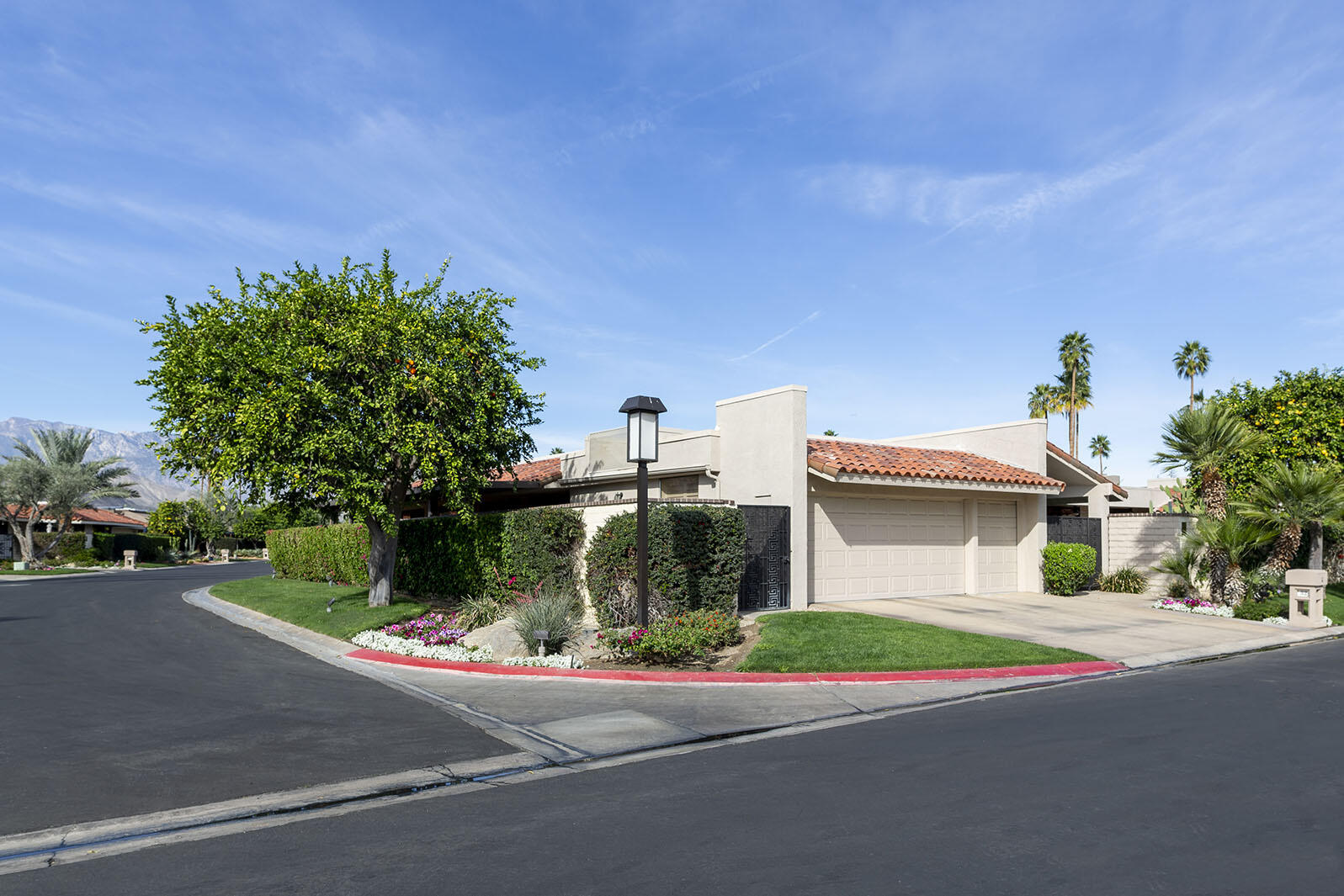 32 Colgate Drive Rancho Mirage, CA 92270 - Photo 3 of 51 a view of a house with a yard and plants