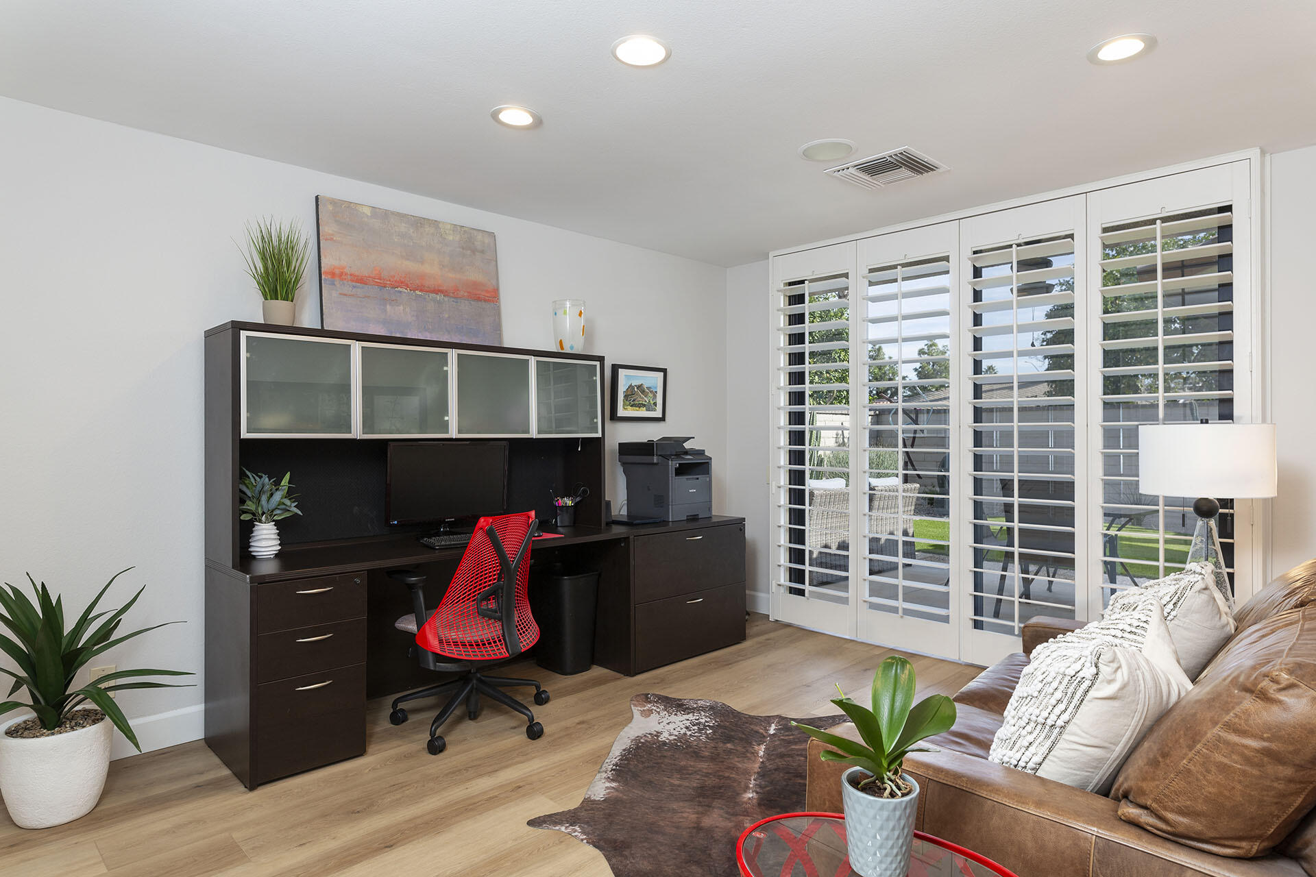 32 Colgate Drive Rancho Mirage, CA 92270 - Photo 31 of 51 a living room with furniture gym equipment and wooden floor