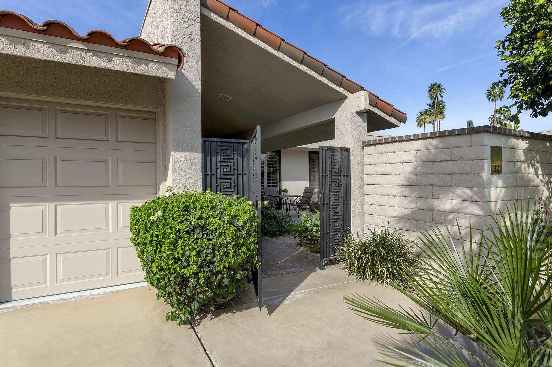 32 Colgate Drive Rancho Mirage, CA 92270 - Photo 4 of 51 a front view of a house with garden