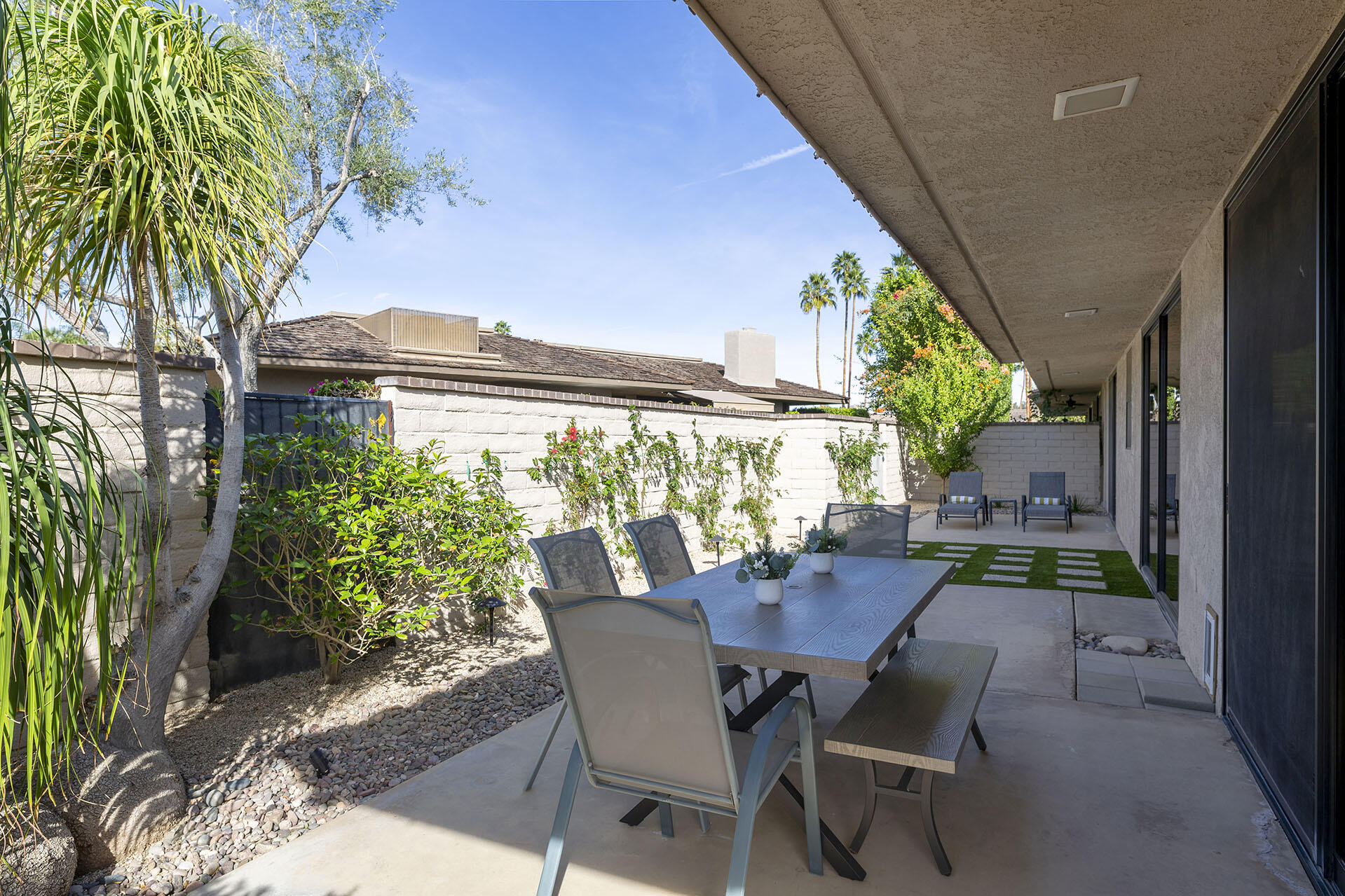 32 Colgate Drive Rancho Mirage, CA 92270 - Photo 47 of 51 a view of a patio with table and chairs and potted plants