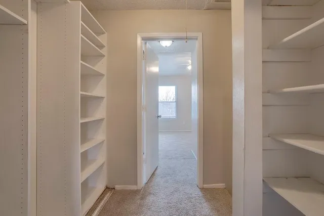 a view of a hallway with closet