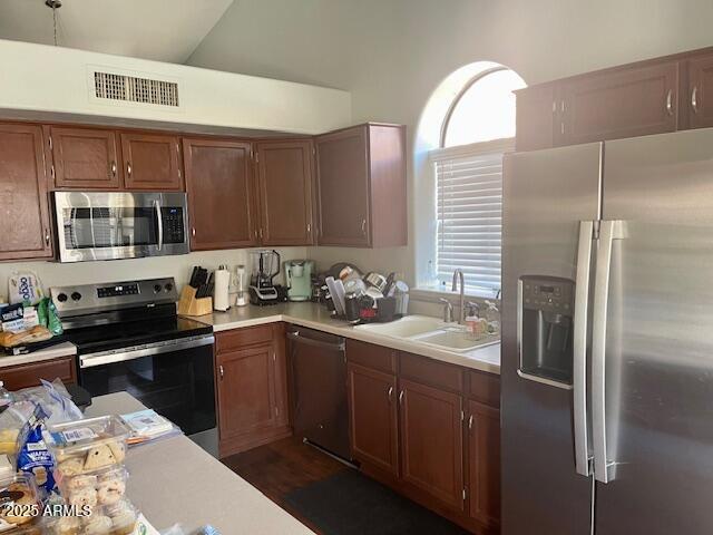 7239 West Morrow Drive Glendale, AZ 85308 - Photo 4 of 19 a kitchen with stainless steel appliances granite countertop a sink a stove and refrigerator
