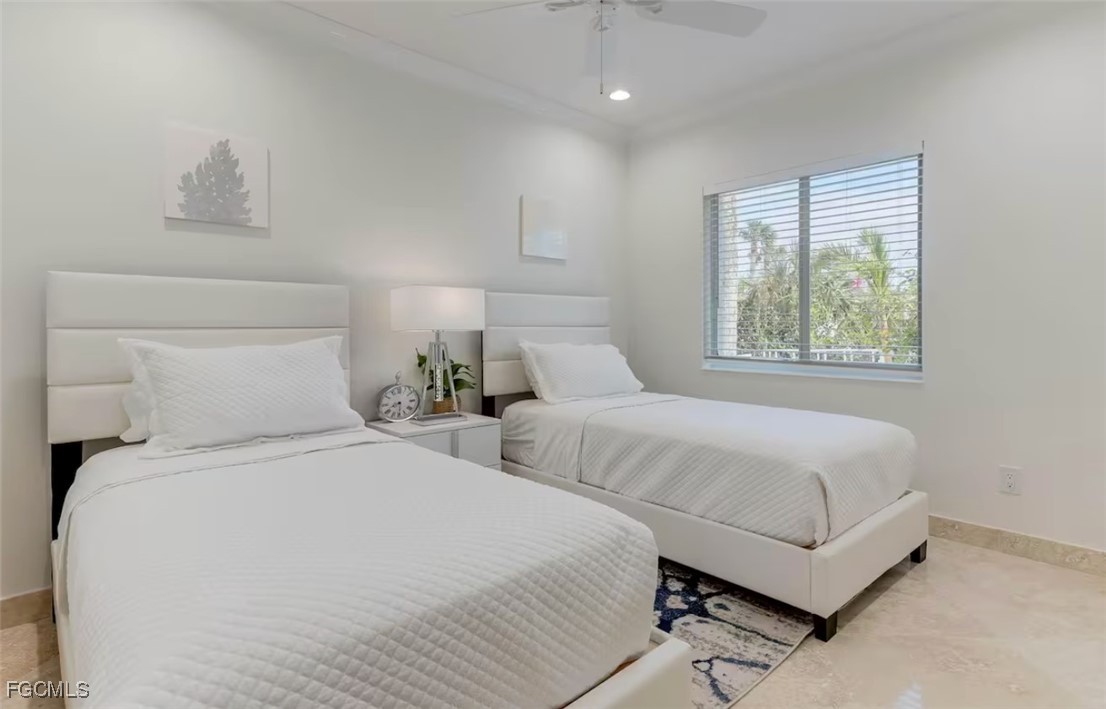 2740 North Beach Road, Unit A & B Englewood, FL 34223 - Photo 18 of 43 a bedroom with two beds and a window