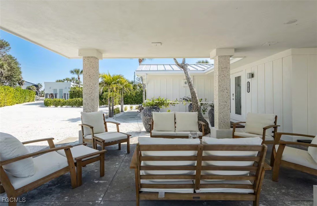 2740 North Beach Road, Unit A & B Englewood, FL 34223 - Photo 25 of 43 a living room with furniture and a large mirror