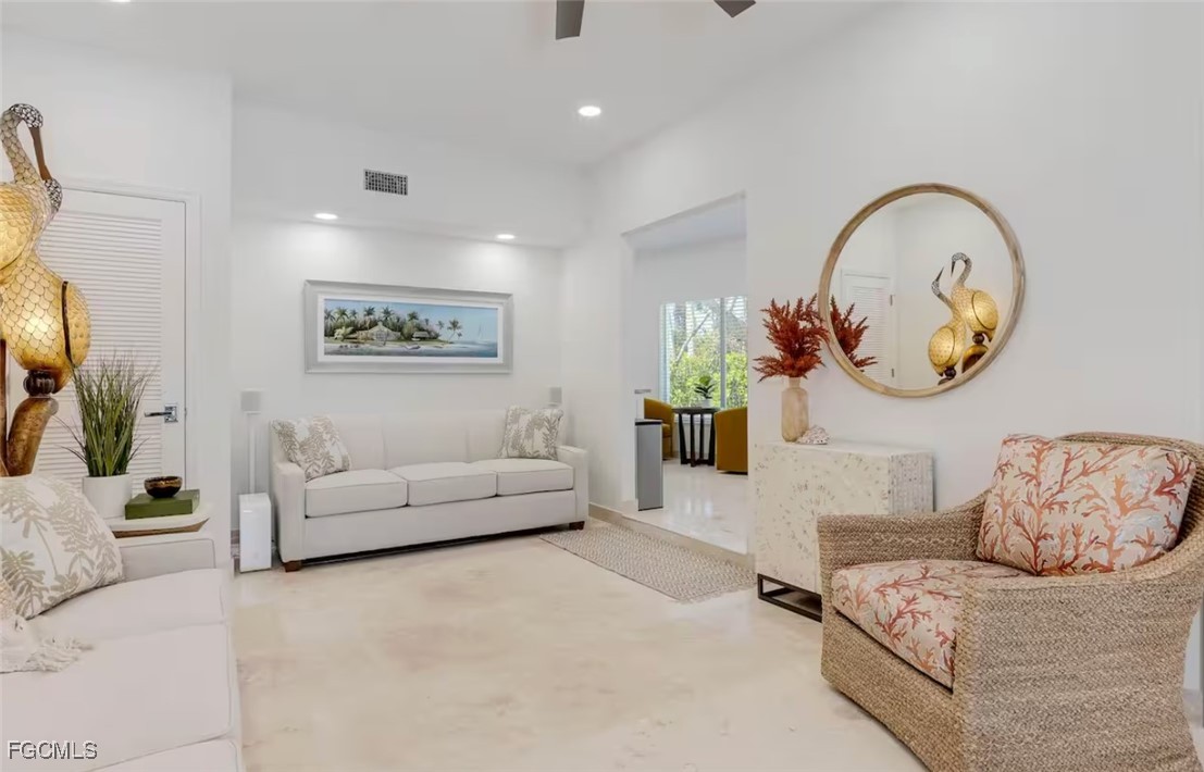 2740 North Beach Road, Unit A & B Englewood, FL 34223 - Photo 33 of 43 a living room with furniture and a mirror