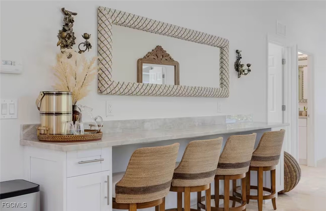 2740 North Beach Road, Unit A & B Englewood, FL 34223 - Photo 38 of 43 a dining room with a table and chairs